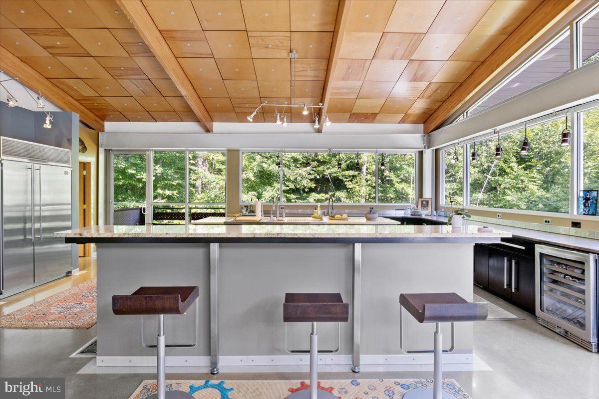 5553 Beverleys Mill Road Broad Run, VA 20137 - Photo 34 of 80 a kitchen with a sink and large windows