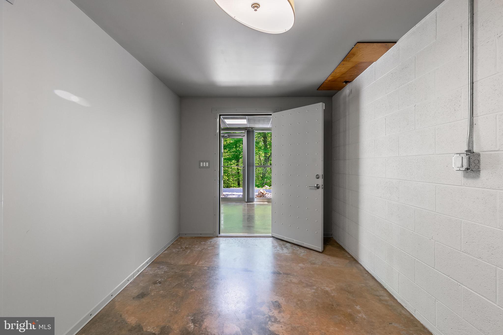 5553 Beverleys Mill Road Broad Run, VA 20137 - Photo 48 of 80 a view of an empty room with wooden floor and a window