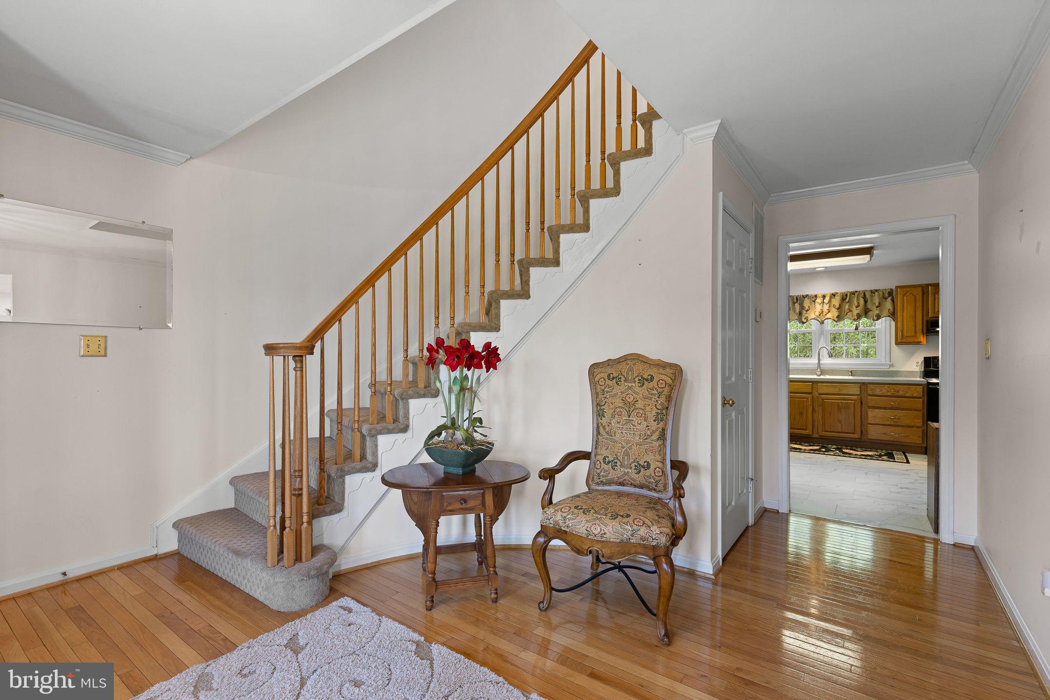 219 Kellogg Mill Road Fredericksburg, VA 22406 - Photo 8 of 47 Foyer with curved staircase and hardwood floors