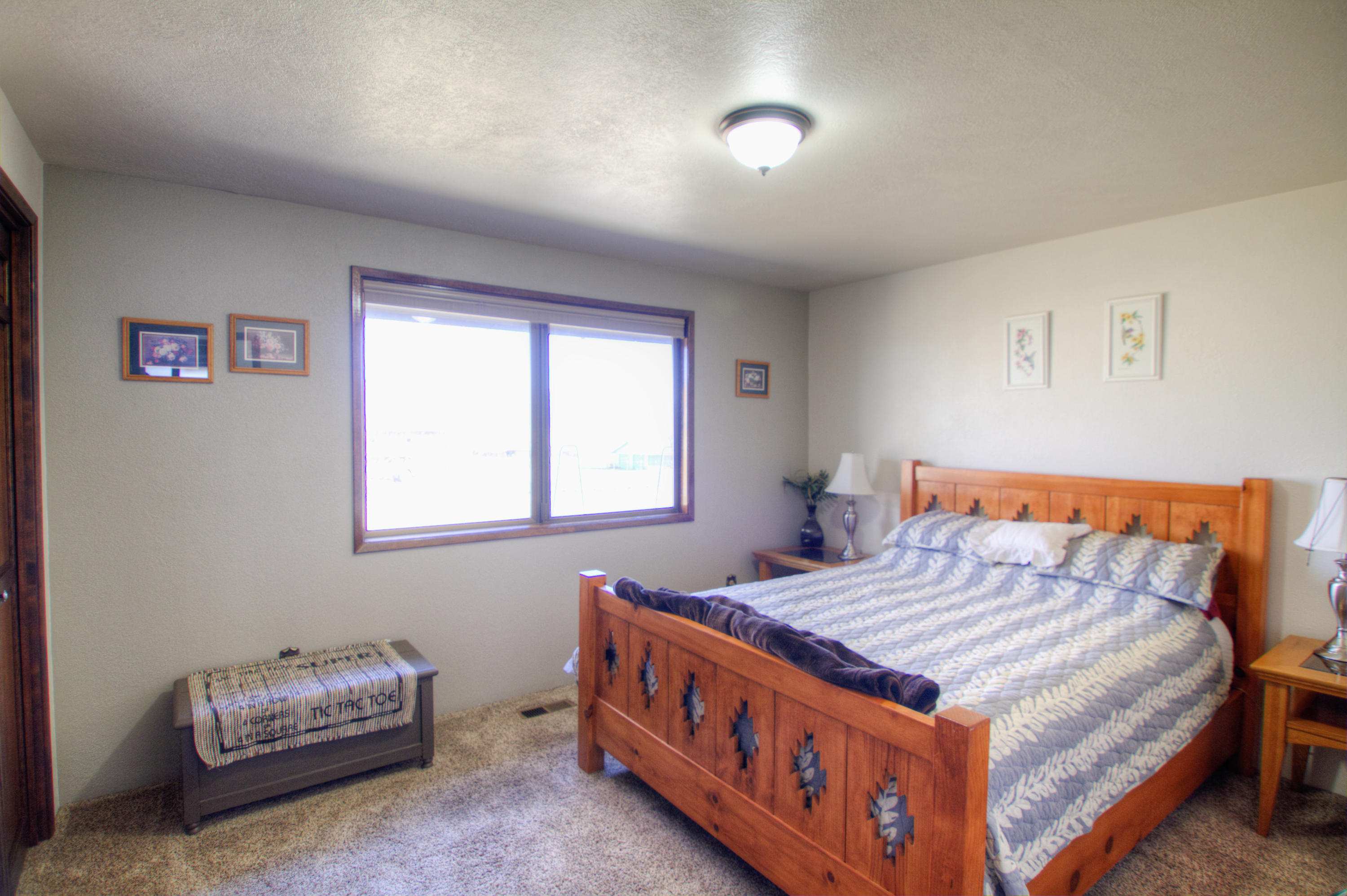 6518 Reeder Road Klamath Falls, OR 97603 - Photo 13 of 25 a bedroom with a bed and a window