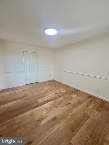 a bathroom with a toilet a sink and a mirror