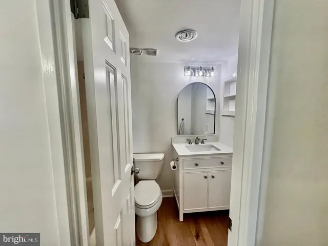 a view of a green field with trees