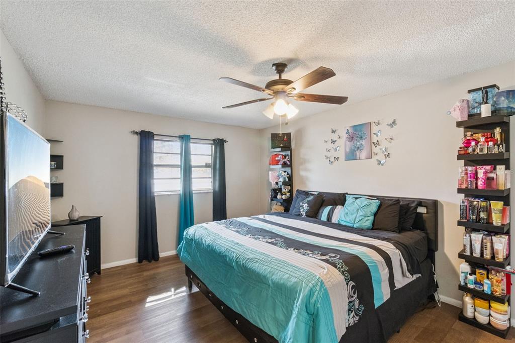 4608 Frisco Circle Orlando, FL 32808 - Photo 11 of 26 a bedroom with a bed and a window
