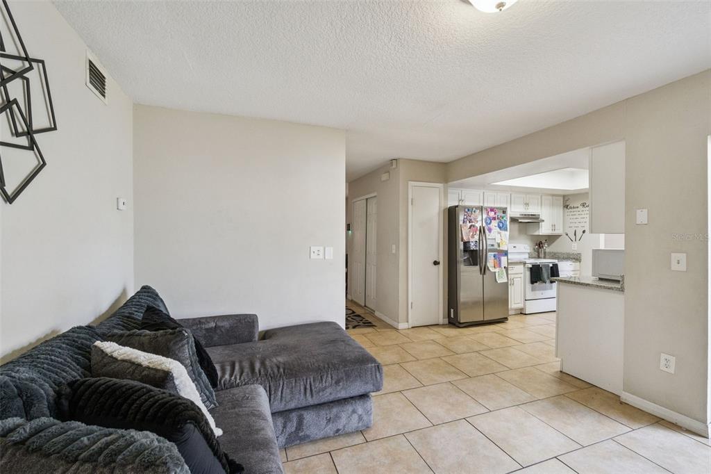 4608 Frisco Circle Orlando, FL 32808 - Photo 4 of 26 a living room with furniture and a couch