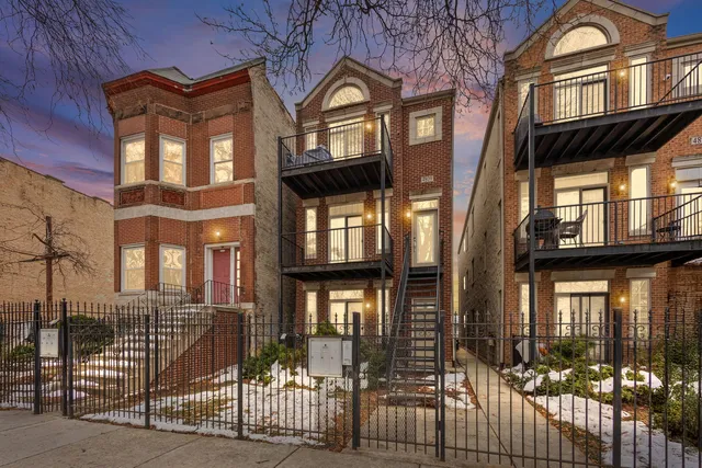 a view of a brick building with many windows