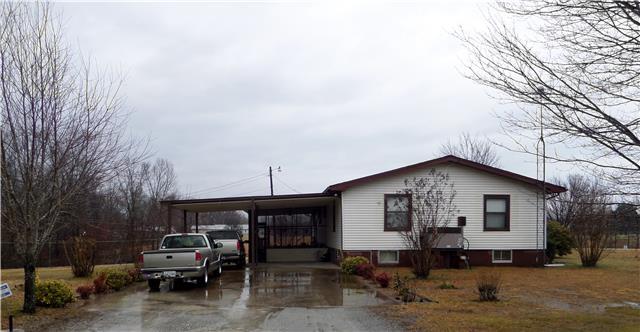 155 Yates Road Hohenwald, TN 38462 - Photo 3 of 20 Side view of house with 2 car carport and screened patio