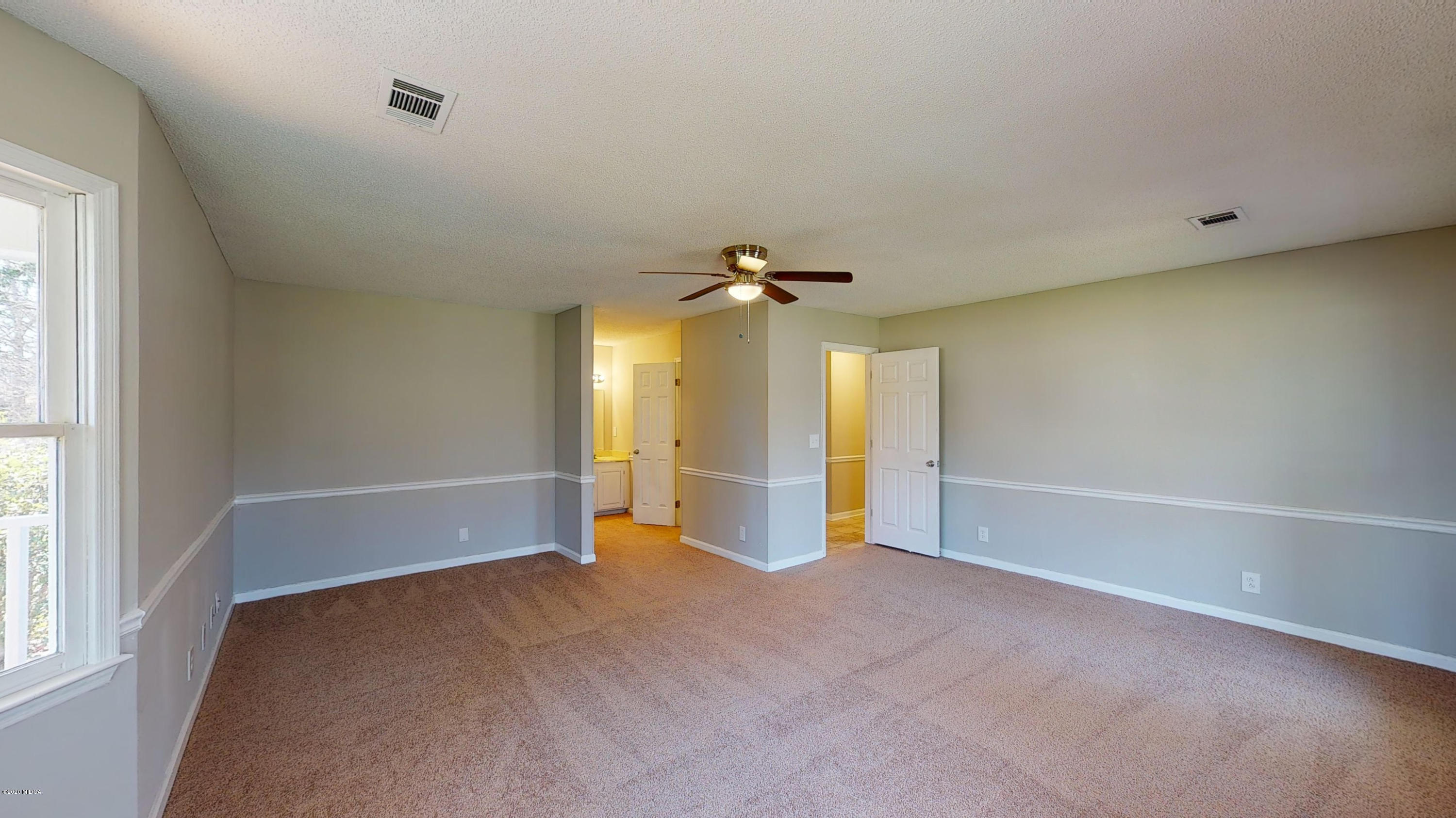 7228 Columbus Road Lizella, GA 31052 - Photo 14 of 41 a view of an empty room with a window