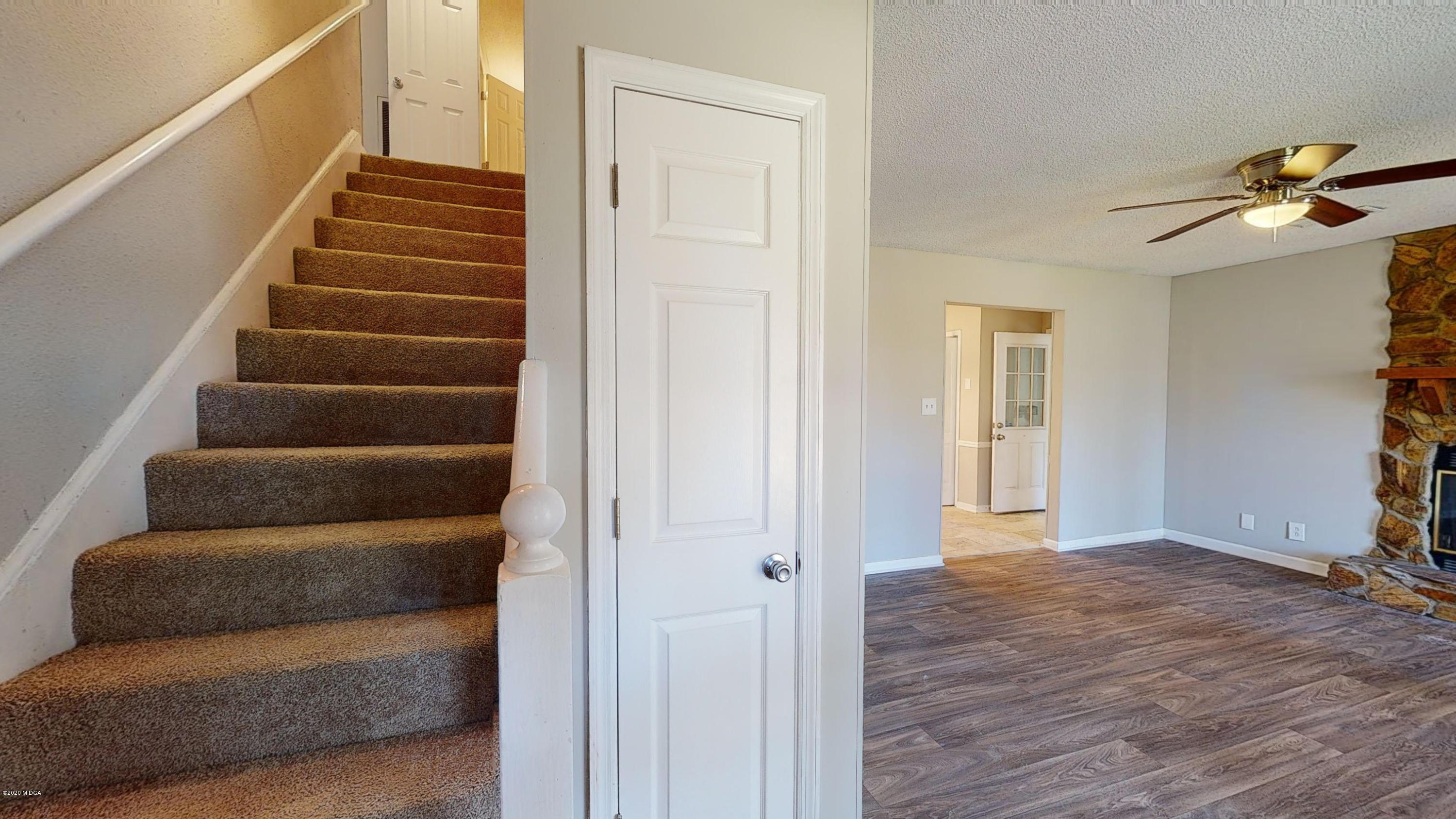7228 Columbus Road Lizella, GA 31052 - Photo 3 of 41 a view of an entryway with wooden floor and door
