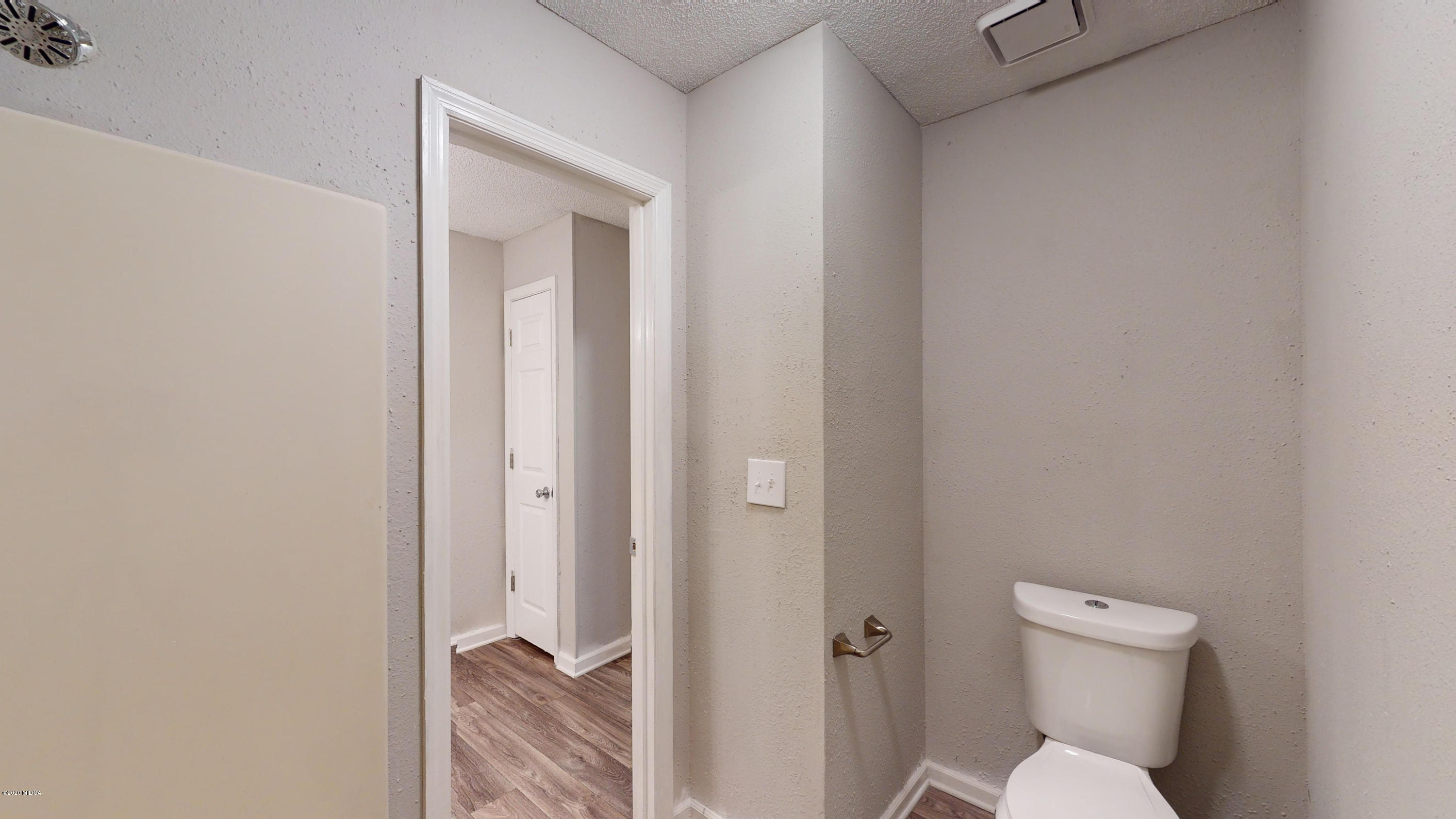 7228 Columbus Road Lizella, GA 31052 - Photo 22 of 41 a bathroom with a toilet