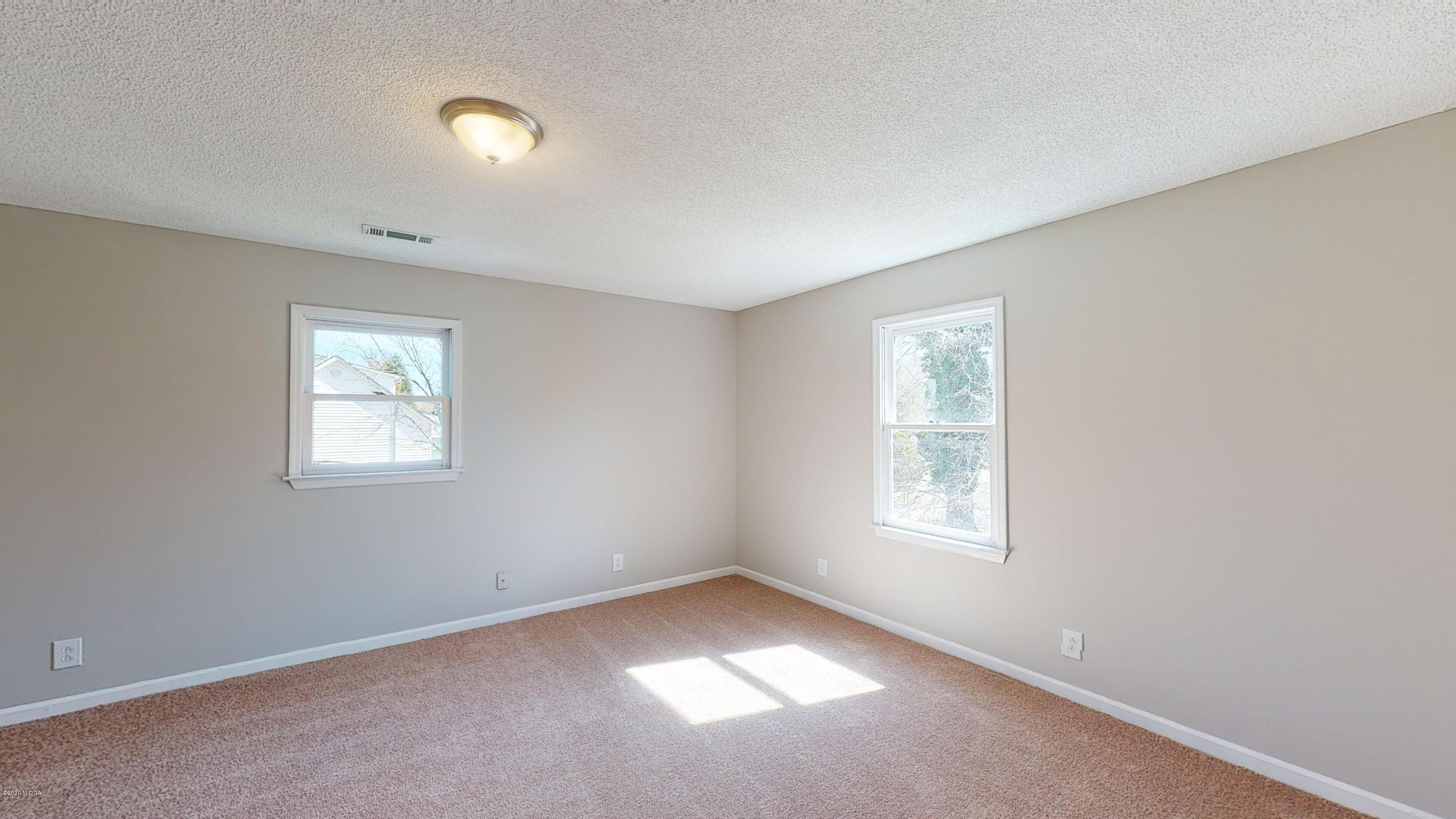 7228 Columbus Road Lizella, GA 31052 - Photo 23 of 41 an empty room with a window