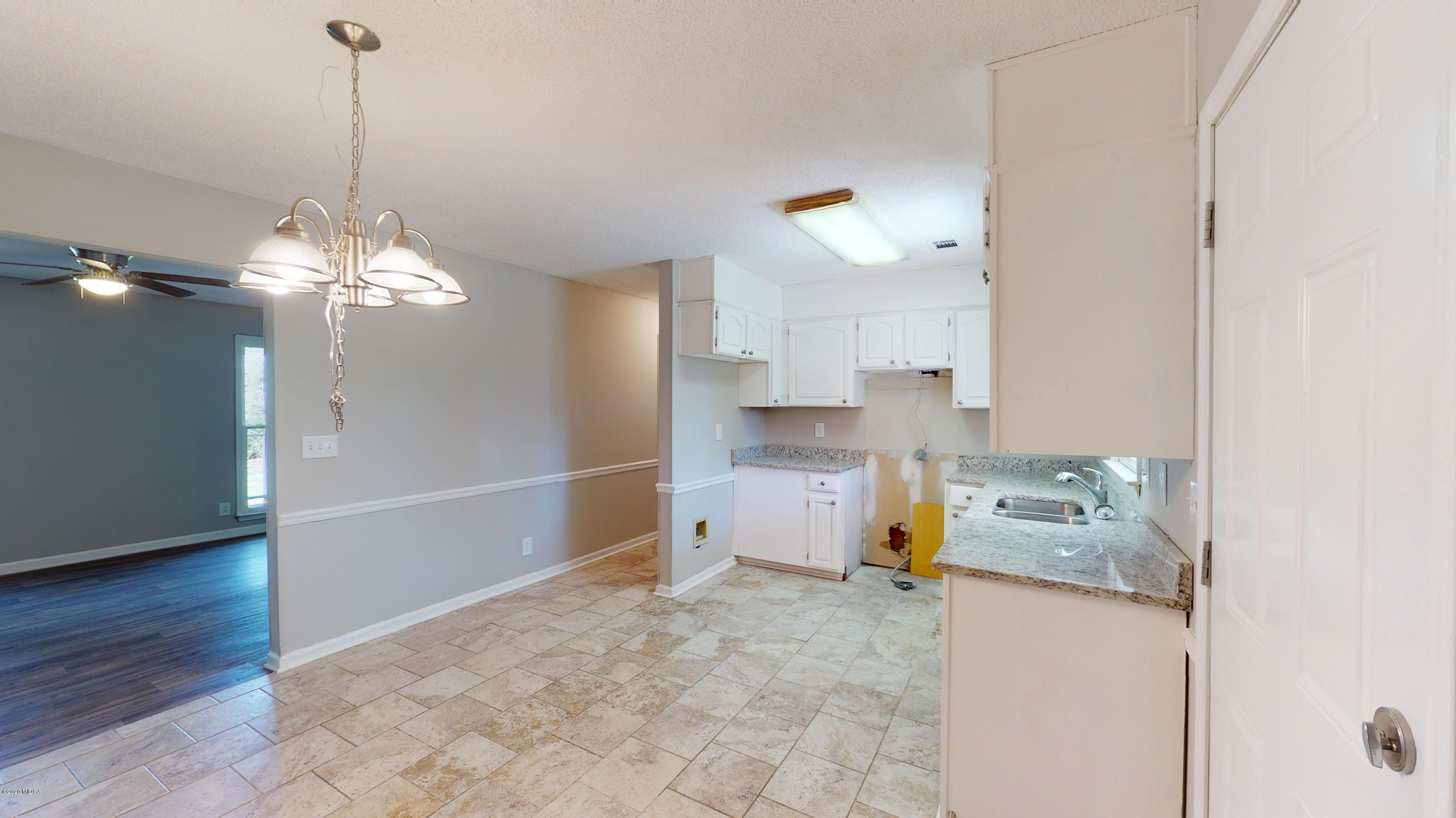 7228 Columbus Road Lizella, GA 31052 - Photo 7 of 41 a kitchen with a refrigerator and a stove top oven