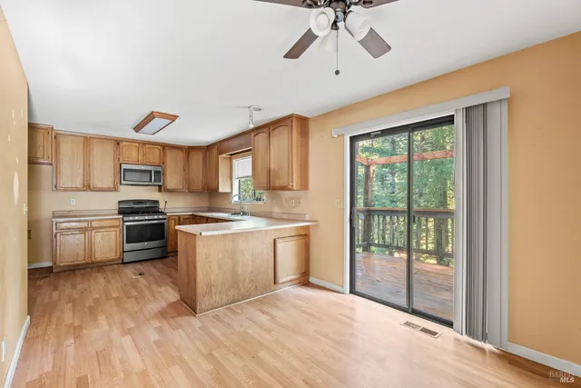 a kitchen with a stove a sink and a refrigerator