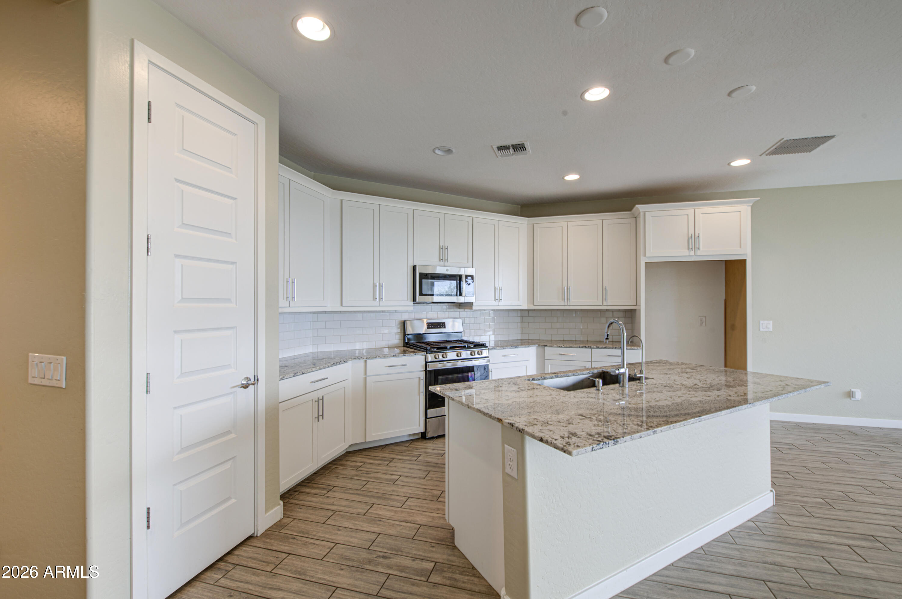12409 East Soloman Road Gold Canyon, AZ 85118 - Photo 15 of 48 a kitchen with granite countertop a sink stove and refrigerator