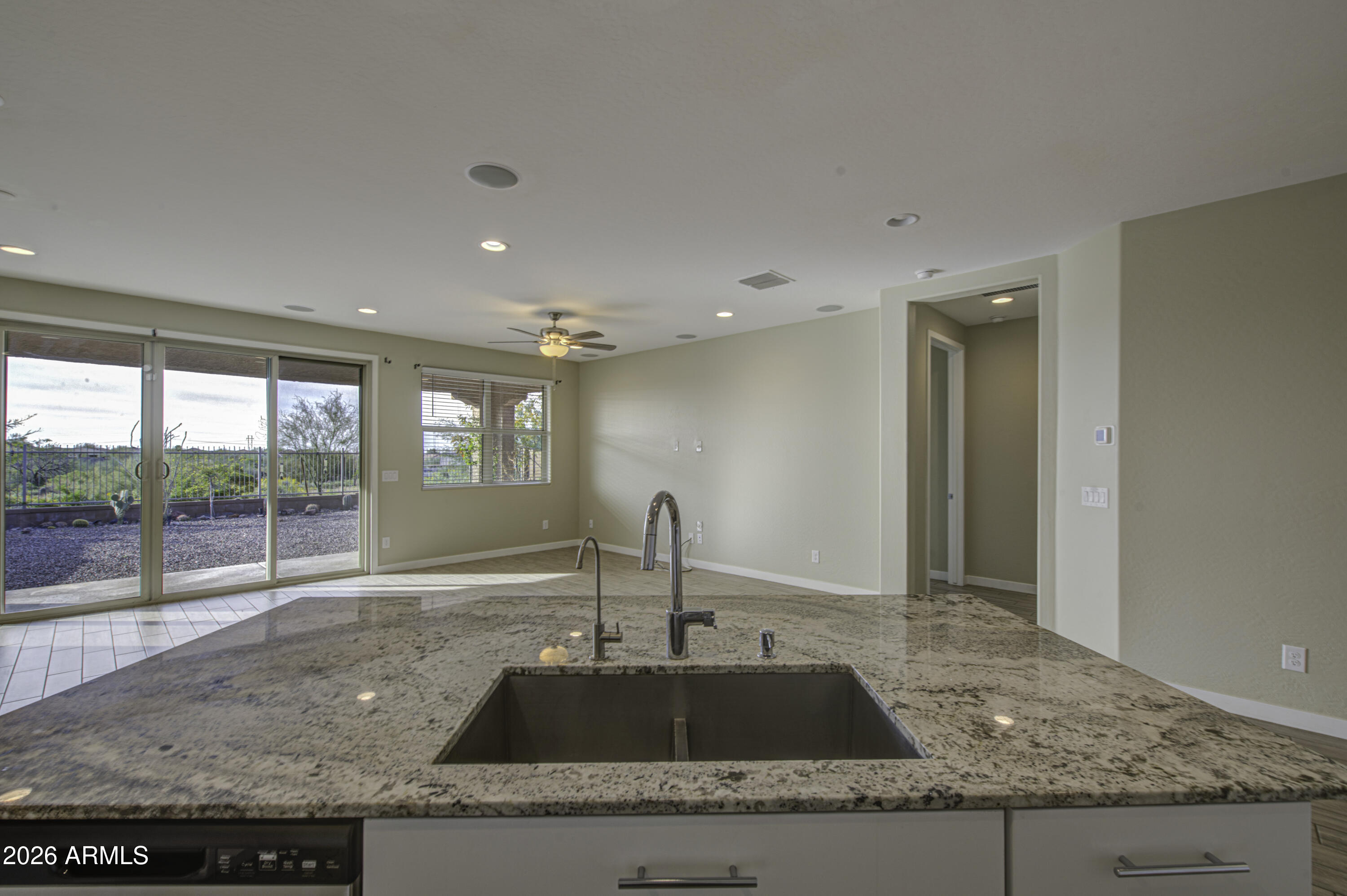12409 East Soloman Road Gold Canyon, AZ 85118 - Photo 17 of 48 a kitchen with granite countertop a sink and a window