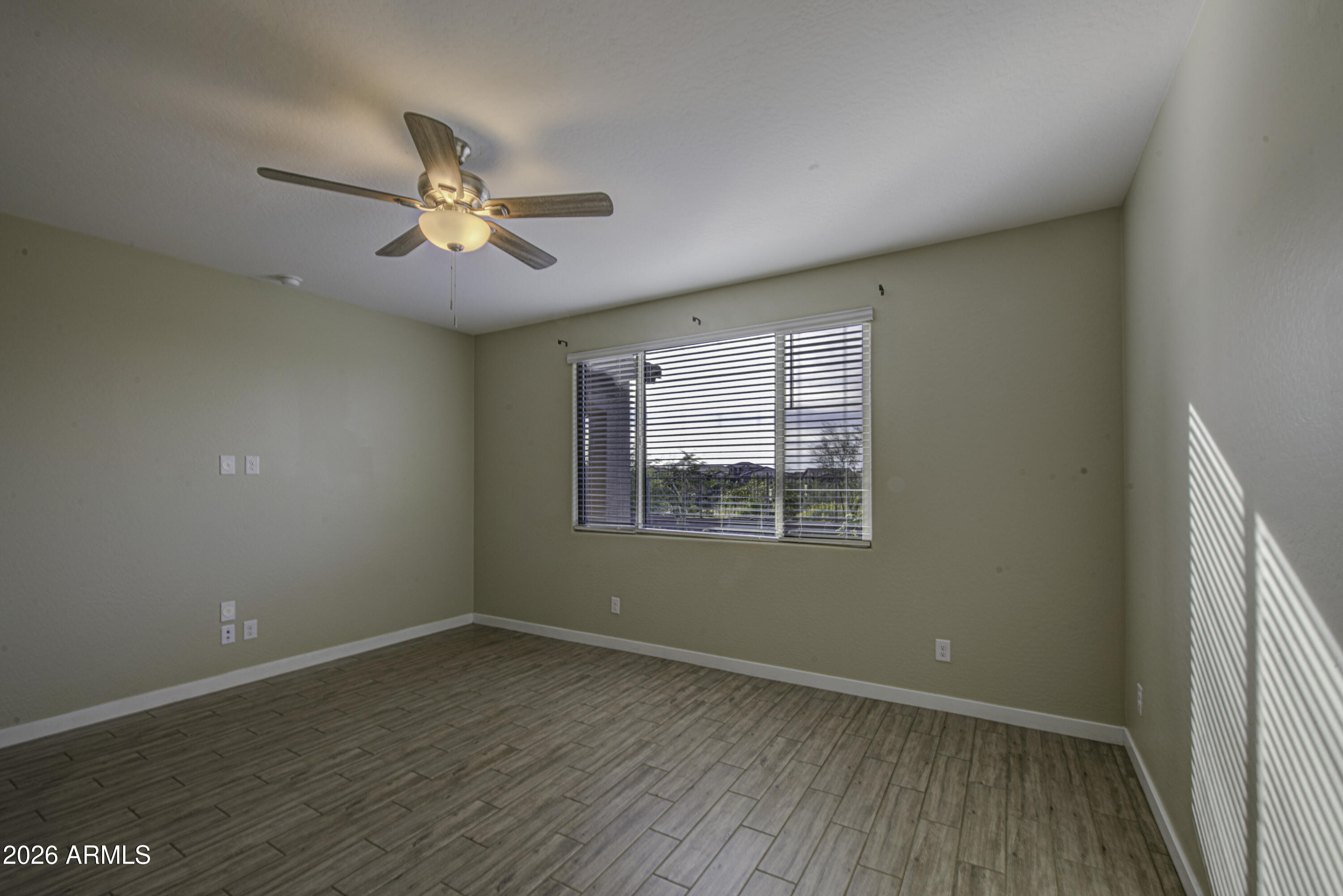 12409 East Soloman Road Gold Canyon, AZ 85118 - Photo 21 of 48 wooden floor in an empty room with a window