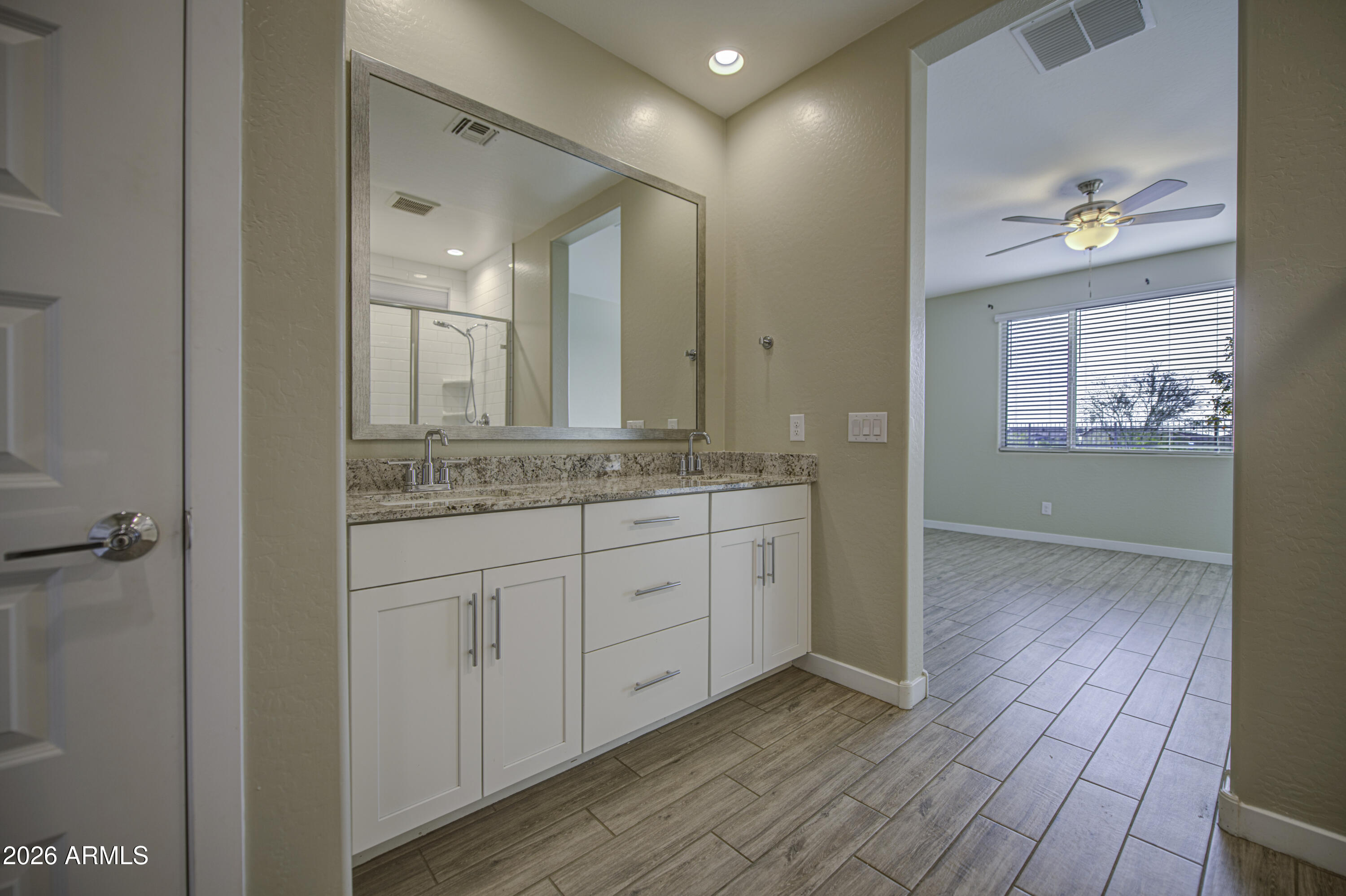 12409 East Soloman Road Gold Canyon, AZ 85118 - Photo 24 of 48 a spacious bathroom with a granite countertop sink a mirror and a