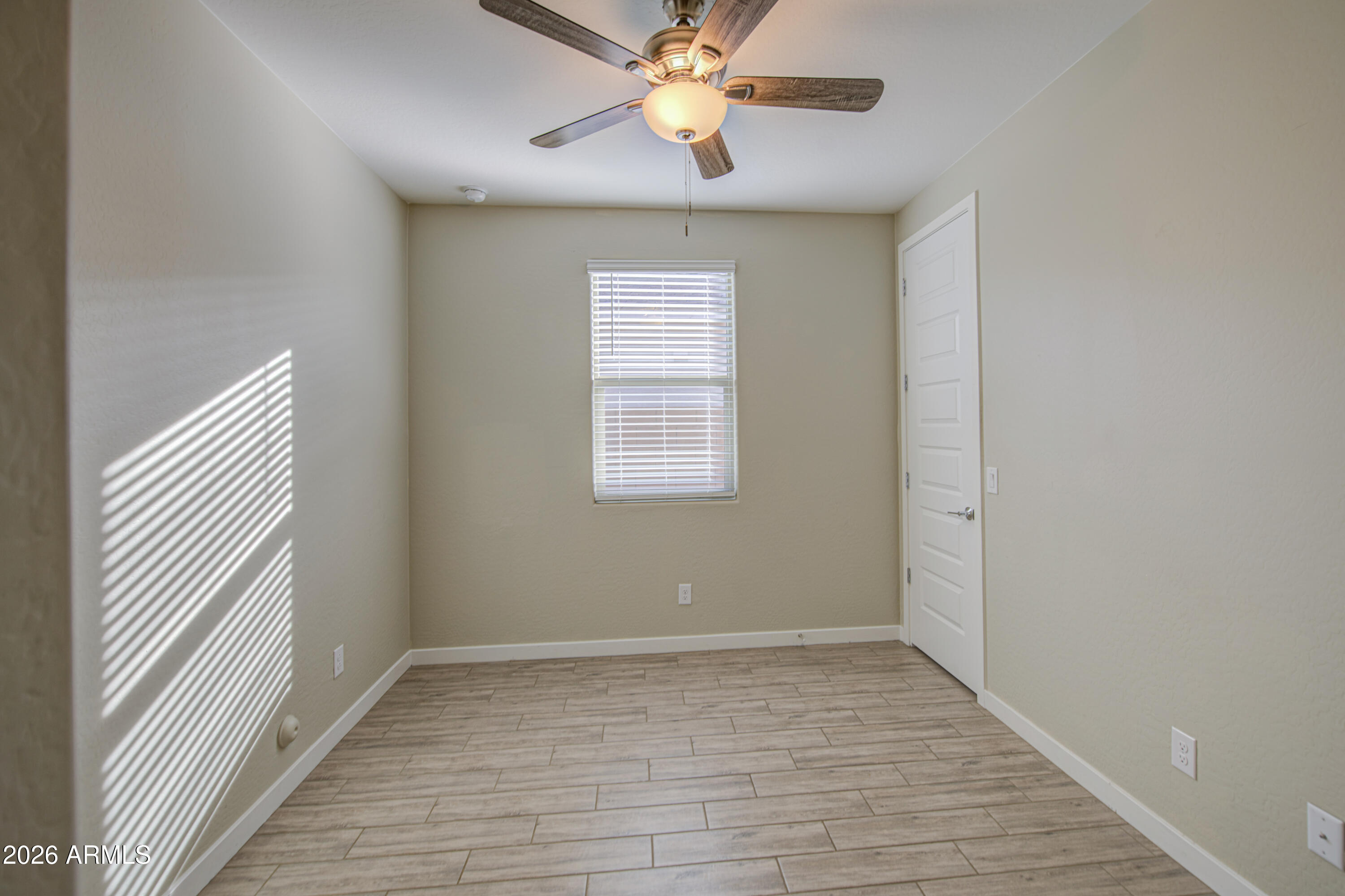 12409 East Soloman Road Gold Canyon, AZ 85118 - Photo 30 of 48 wooden floor in an empty room with a window