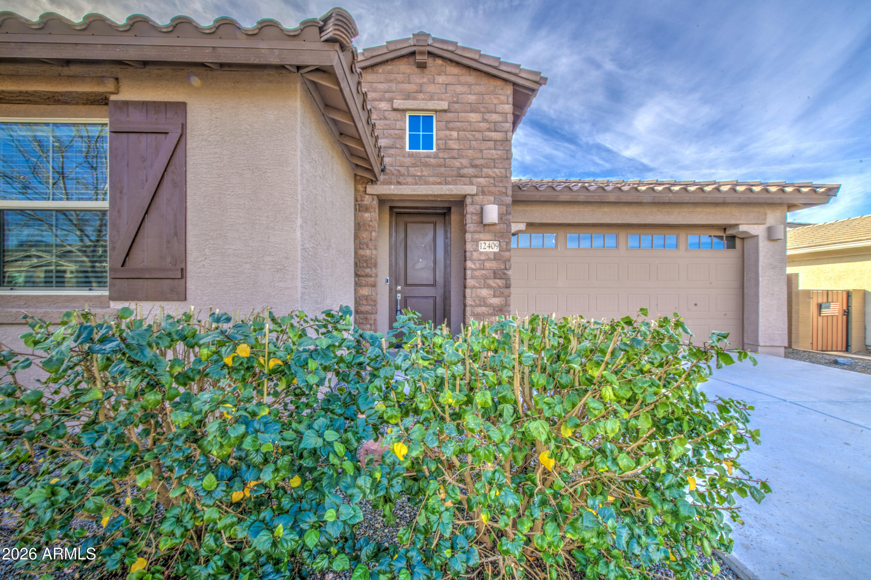 12409 East Soloman Road Gold Canyon, AZ 85118 - Photo 3 of 48 a front view of a house with garden