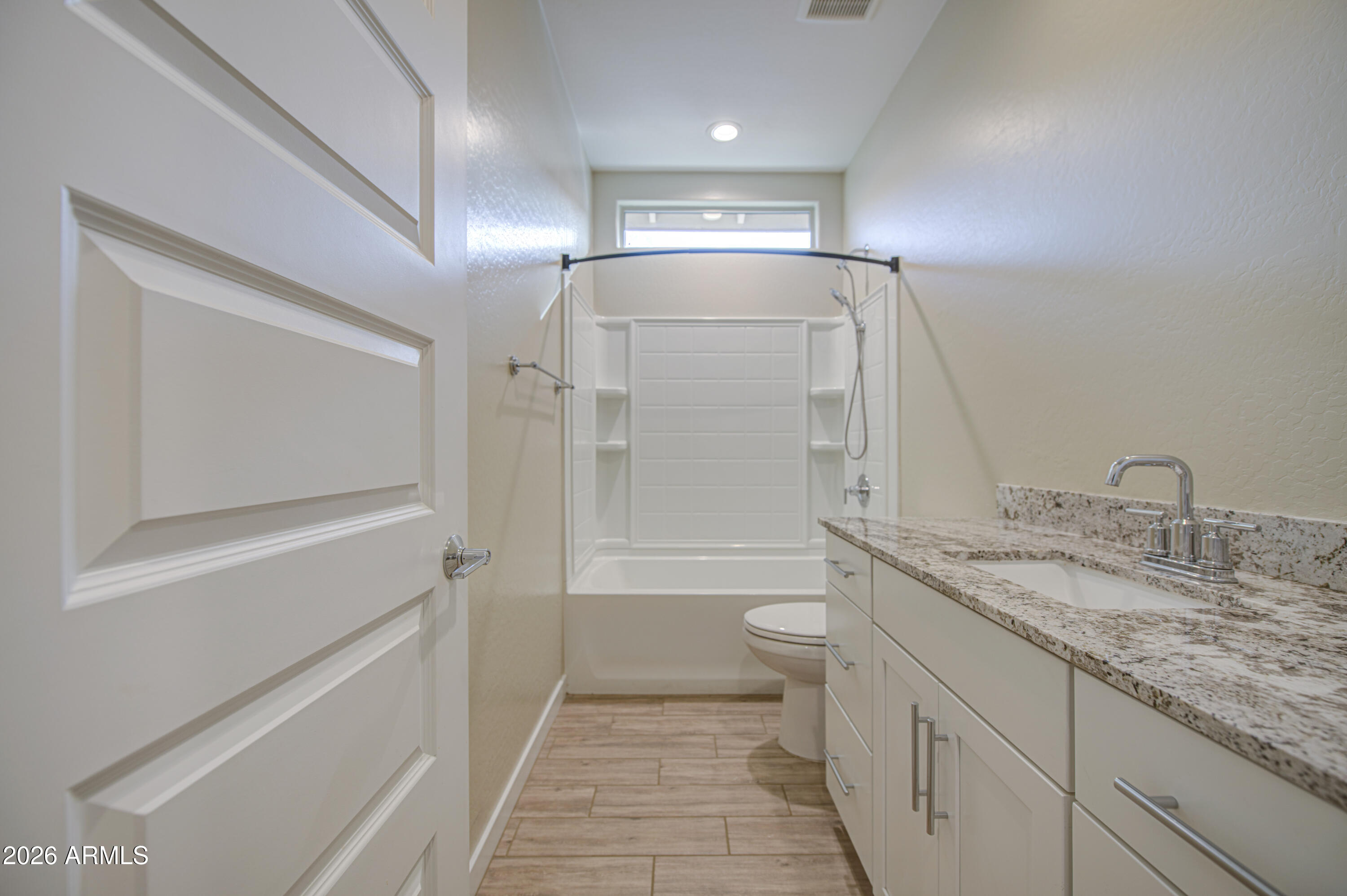 12409 East Soloman Road Gold Canyon, AZ 85118 - Photo 37 of 48 a bathroom with a granite countertop sink mirror vanity and toilet
