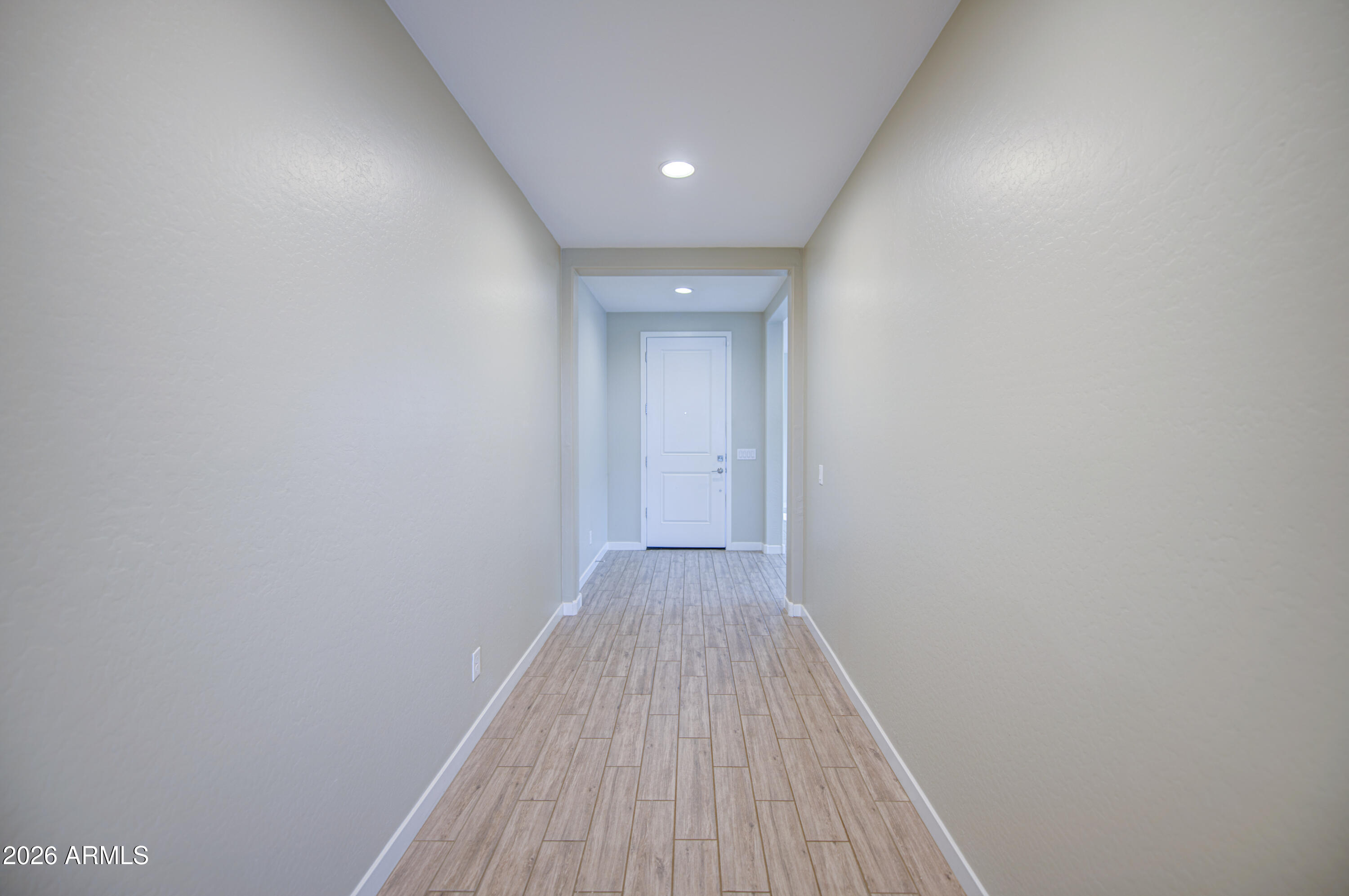12409 East Soloman Road Gold Canyon, AZ 85118 - Photo 4 of 48 a view of a hallway with wooden floor