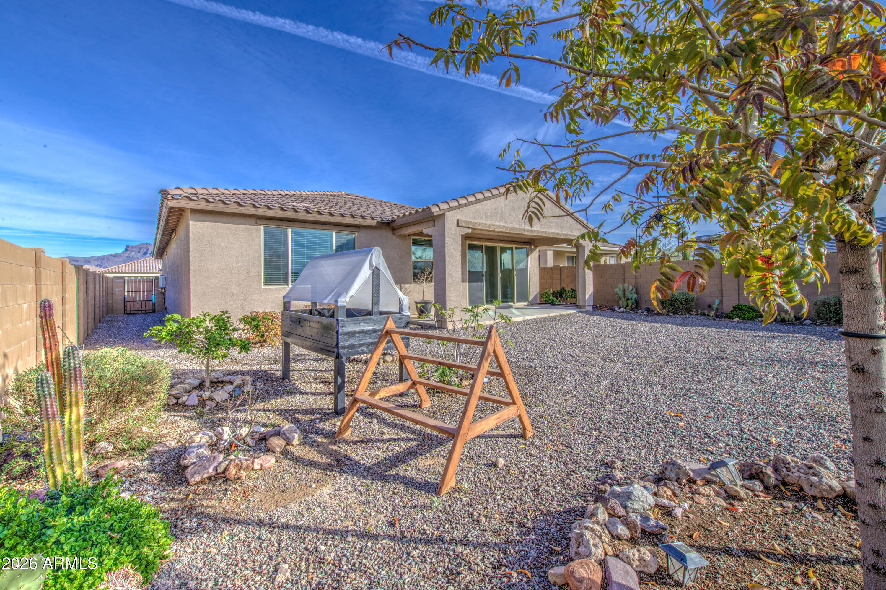 12409 East Soloman Road Gold Canyon, AZ 85118 - Photo 45 of 47 a house view with a seating space and garden