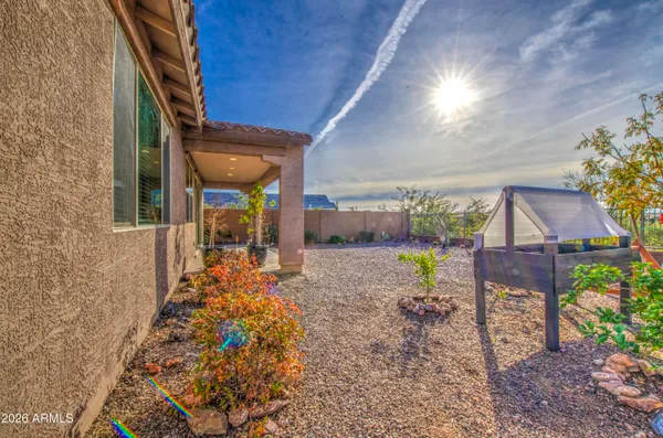 a view of a house with backyard porch and sitting area
