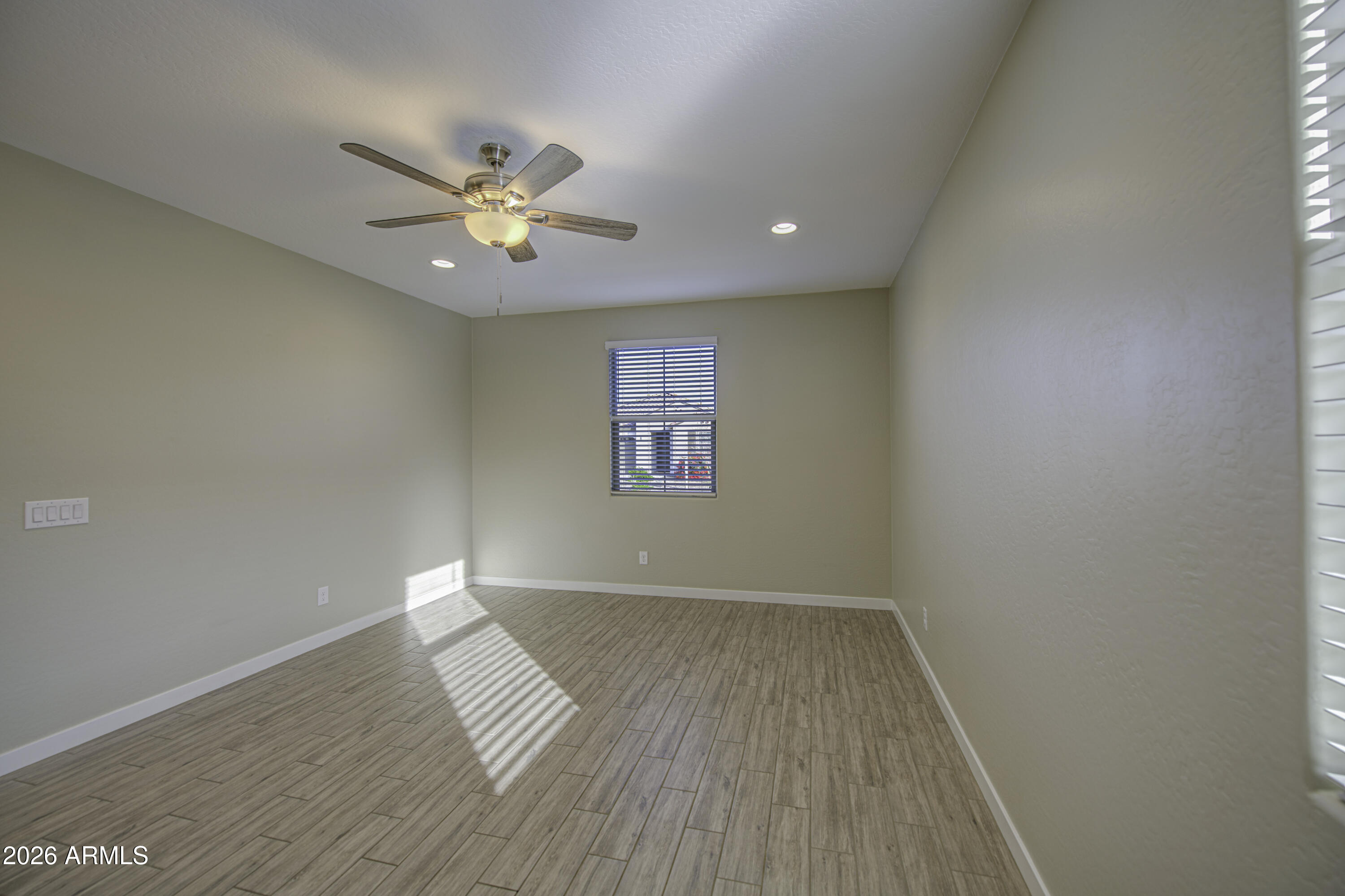 12409 East Soloman Road Gold Canyon, AZ 85118 - Photo 6 of 48 wooden floor in an empty room with a window