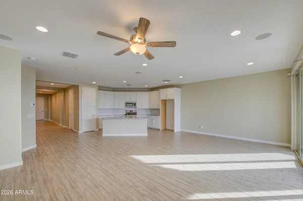 a view of kitchen with cabinets and wooden floor