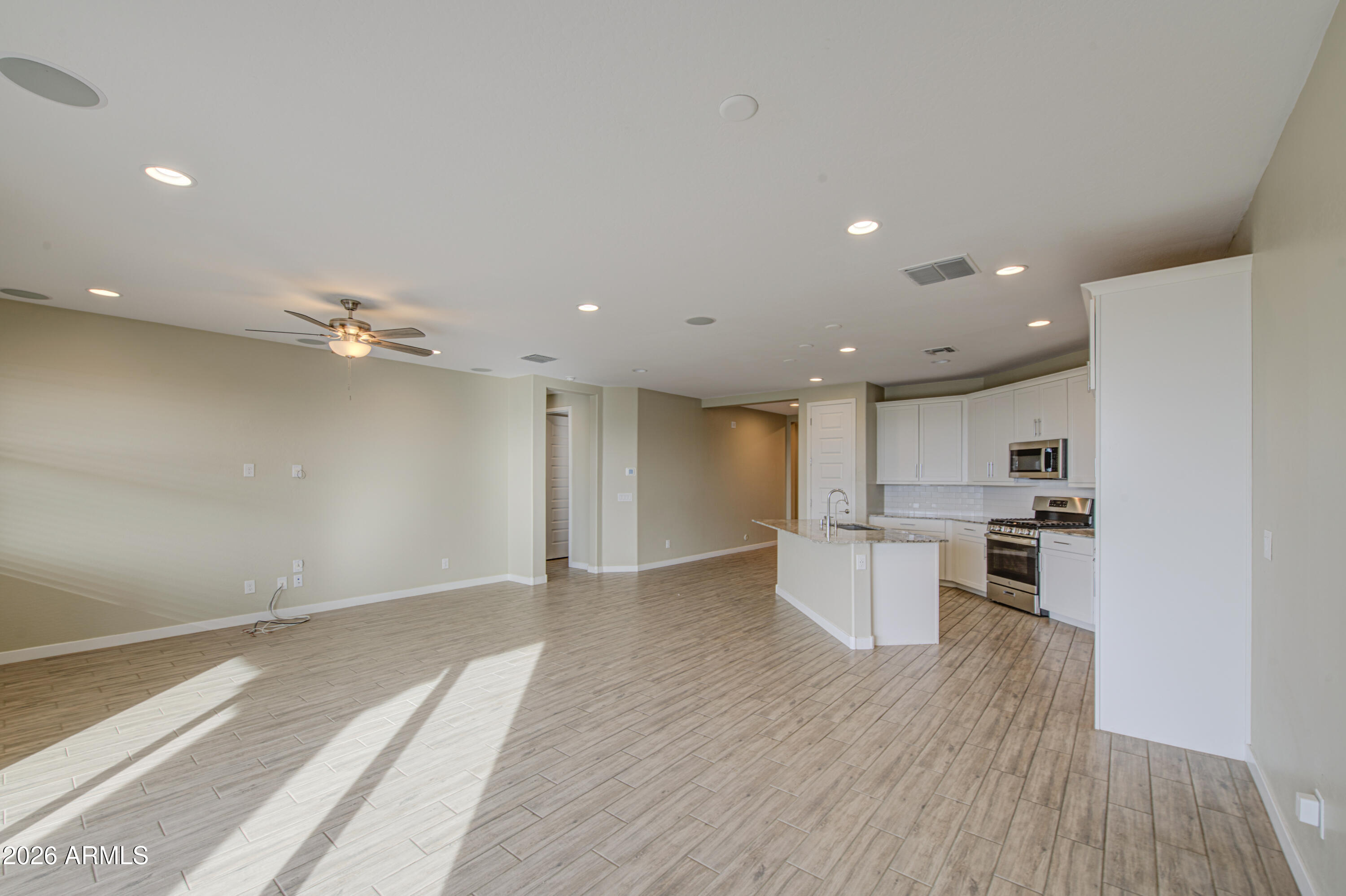 12409 East Soloman Road Gold Canyon, AZ 85118 - Photo 10 of 48 an empty room with kitchen and a sink