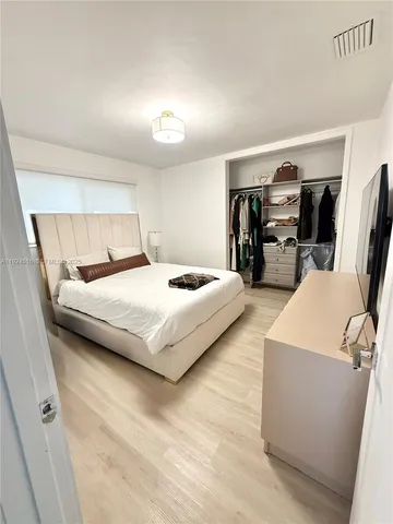 a bedroom with bed and utility