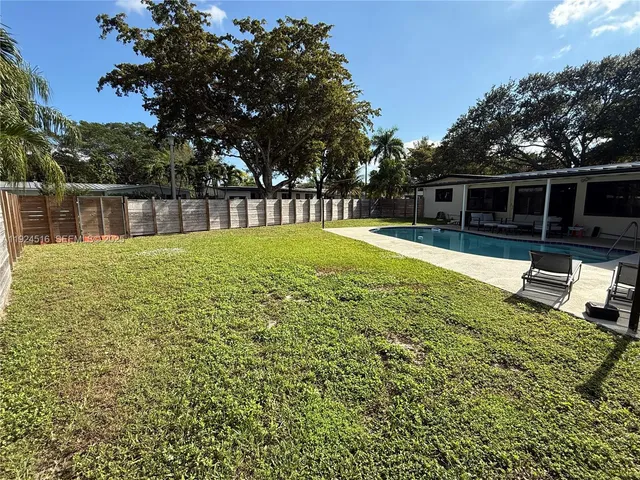 a view of backyard with green space