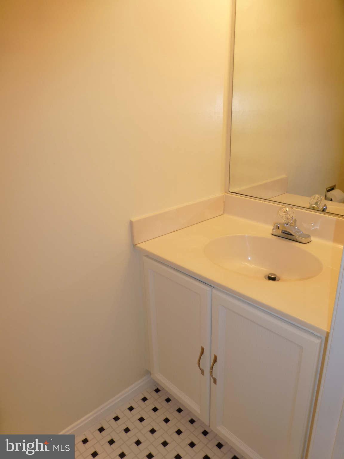 7311 Treetop Hill Lane Springfield, VA 22152 - Photo 12 of 26 a bathroom with a sink and vanity