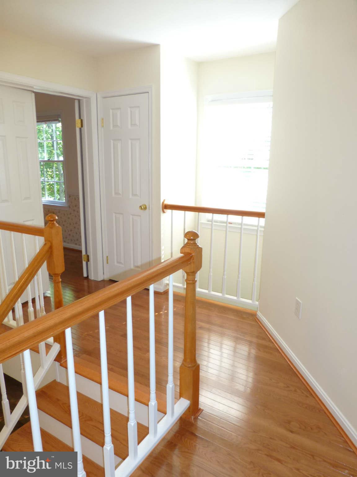 7311 Treetop Hill Lane Springfield, VA 22152 - Photo 19 of 26 a view of staircase with wooden floor