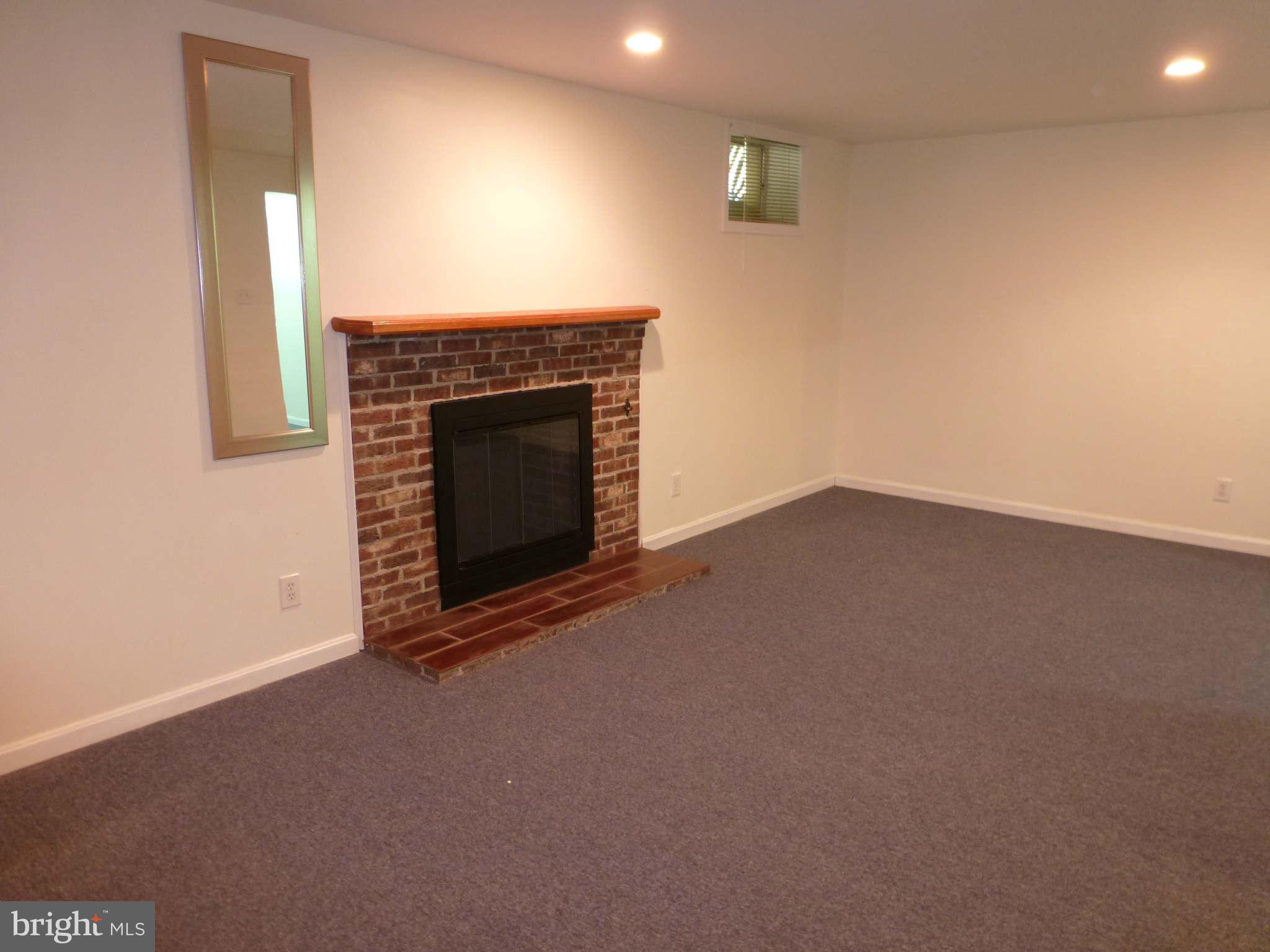 7311 Treetop Hill Lane Springfield, VA 22152 - Photo 22 of 26 a view of empty room with a fireplace