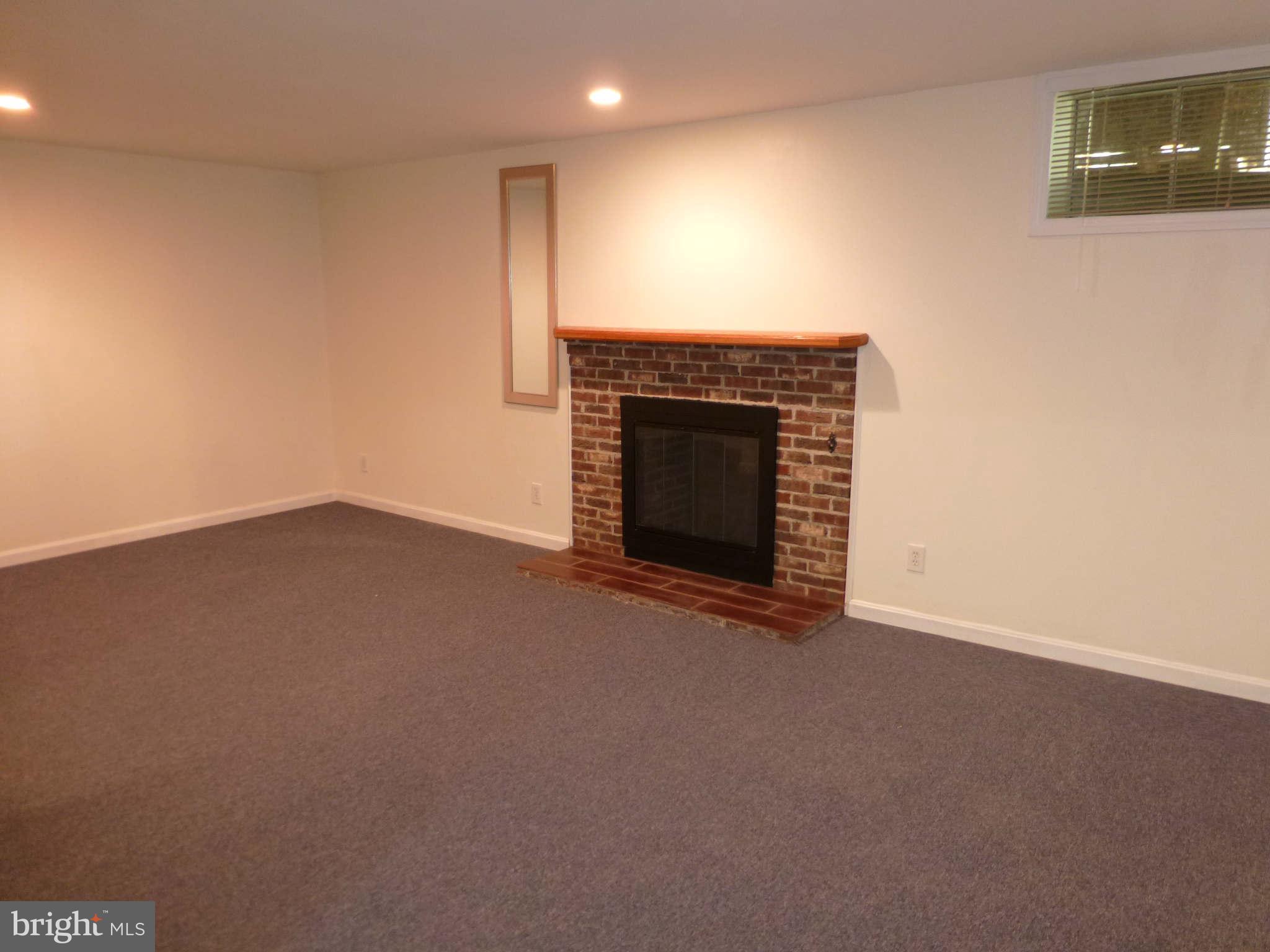 7311 Treetop Hill Lane Springfield, VA 22152 - Photo 23 of 26 a view of empty room with a fireplace