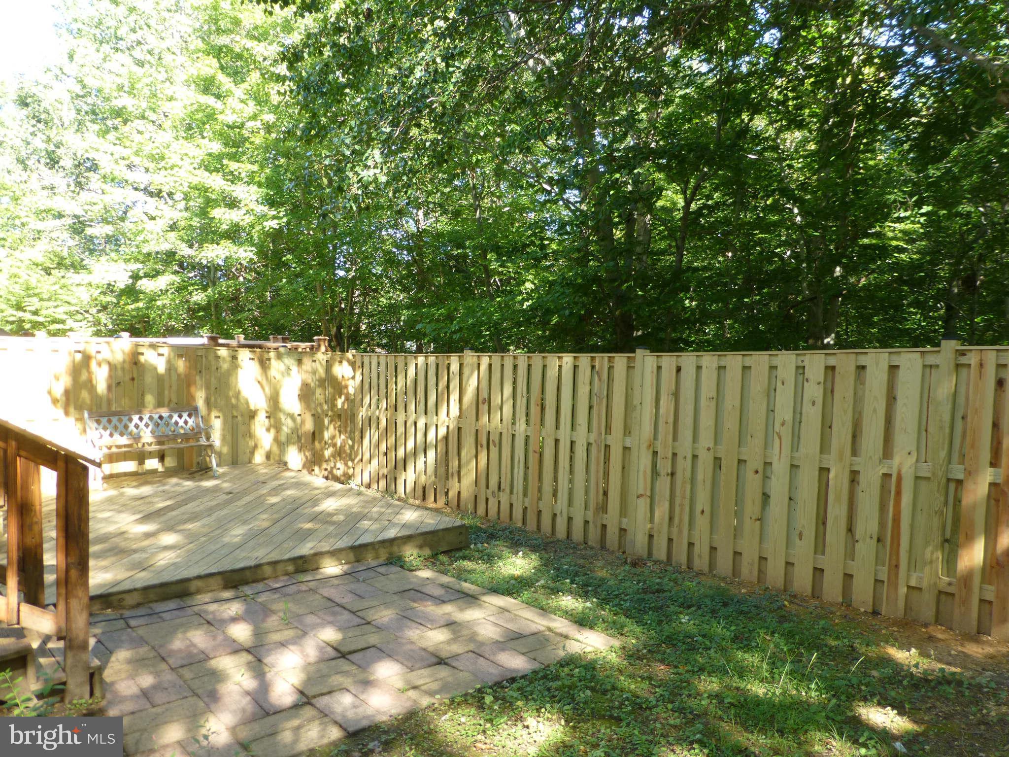 7311 Treetop Hill Lane Springfield, VA 22152 - Photo 25 of 26 a view of a yard with wooden fence