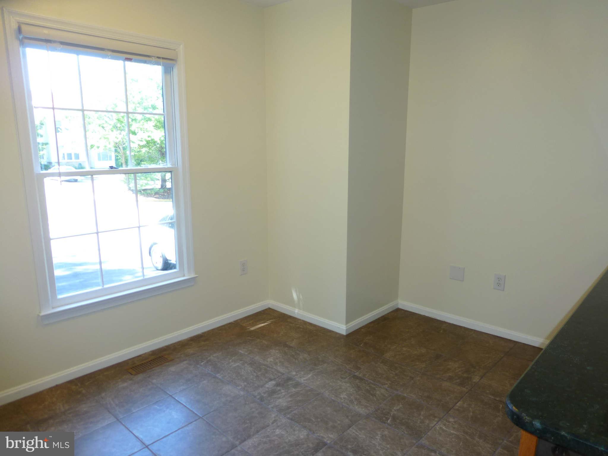 7311 Treetop Hill Lane Springfield, VA 22152 - Photo 10 of 26 an empty room with a window