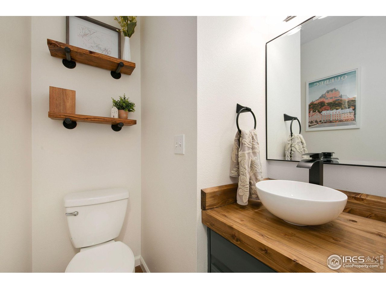 1138 Argento Drive Fort Collins, CO 80521 - Photo 11 of 25 a bathroom with a sink and mirror
