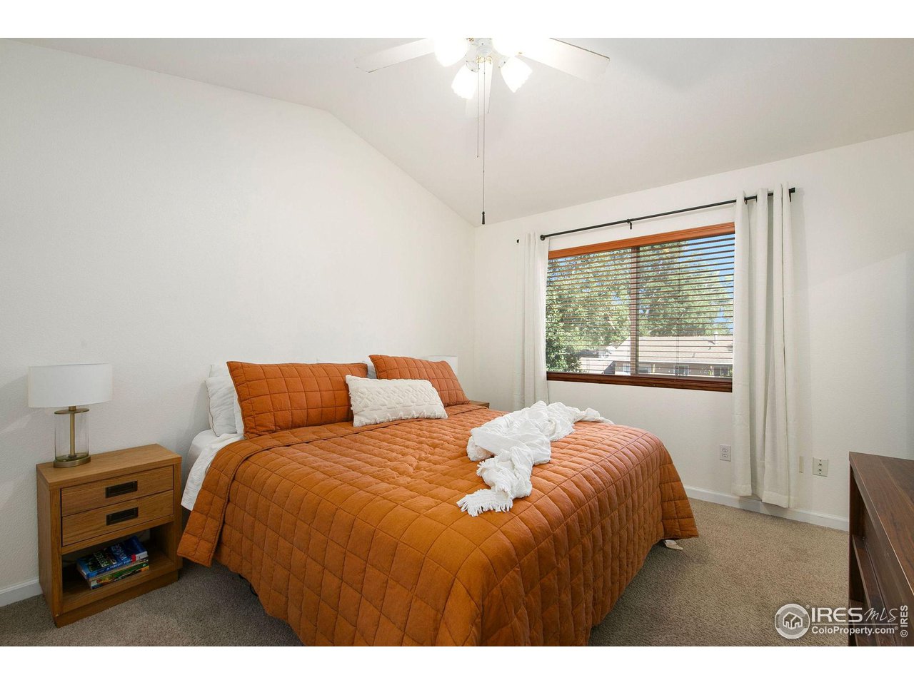 1138 Argento Drive Fort Collins, CO 80521 - Photo 14 of 25 a bedroom with a bed and a tv