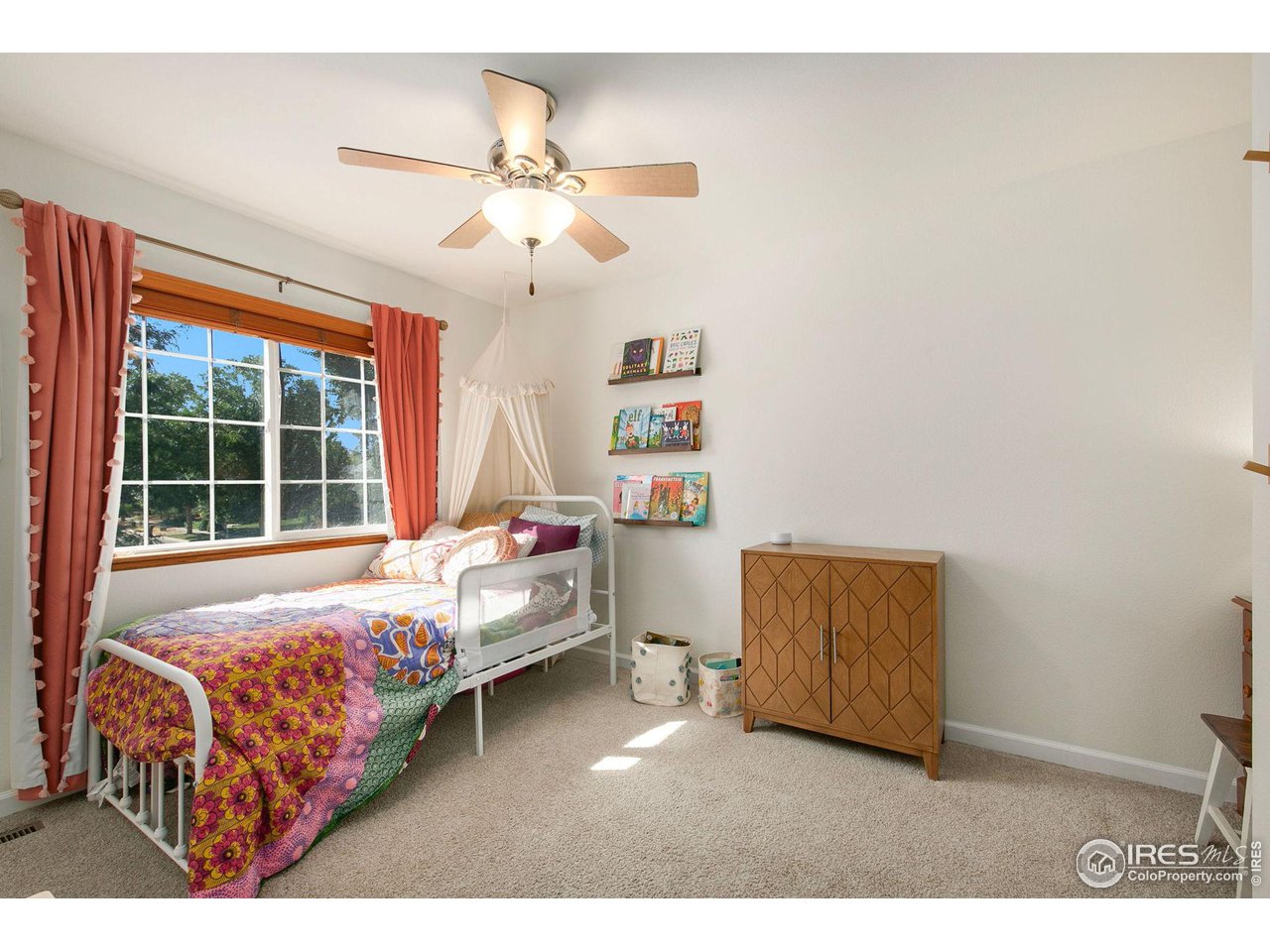 1138 Argento Drive Fort Collins, CO 80521 - Photo 16 of 25 a bedroom with a bed and a window