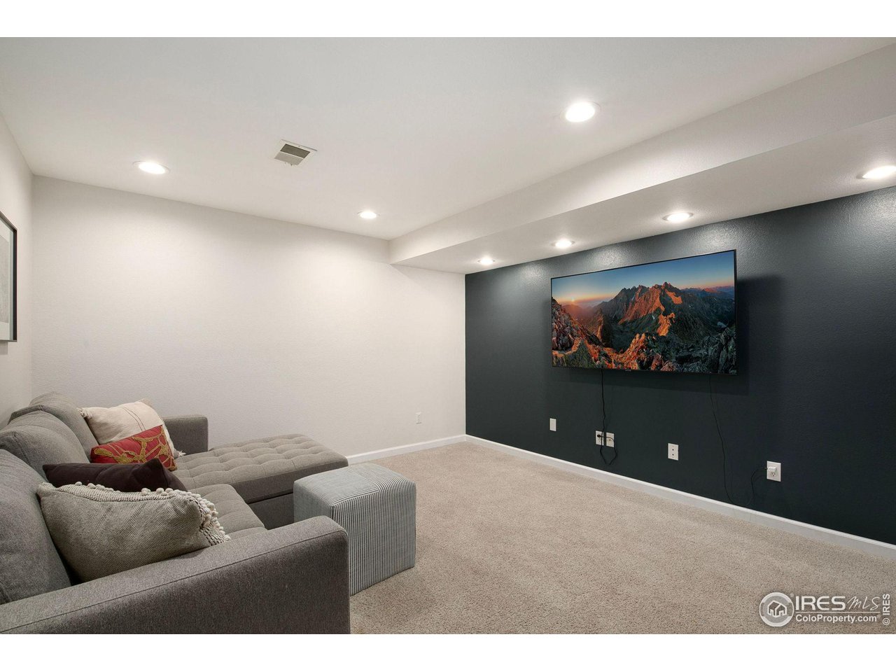 1138 Argento Drive Fort Collins, CO 80521 - Photo 20 of 25 a projector room with furniture and screen