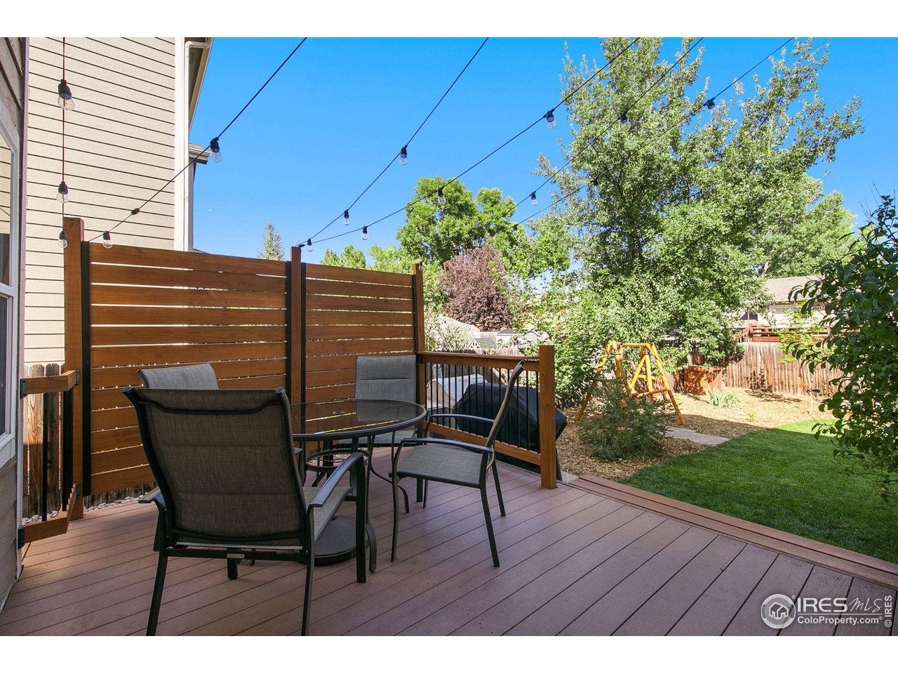 1138 Argento Drive Fort Collins, CO 80521 - Photo 24 of 25 a view of a chairs and table in the backyard
