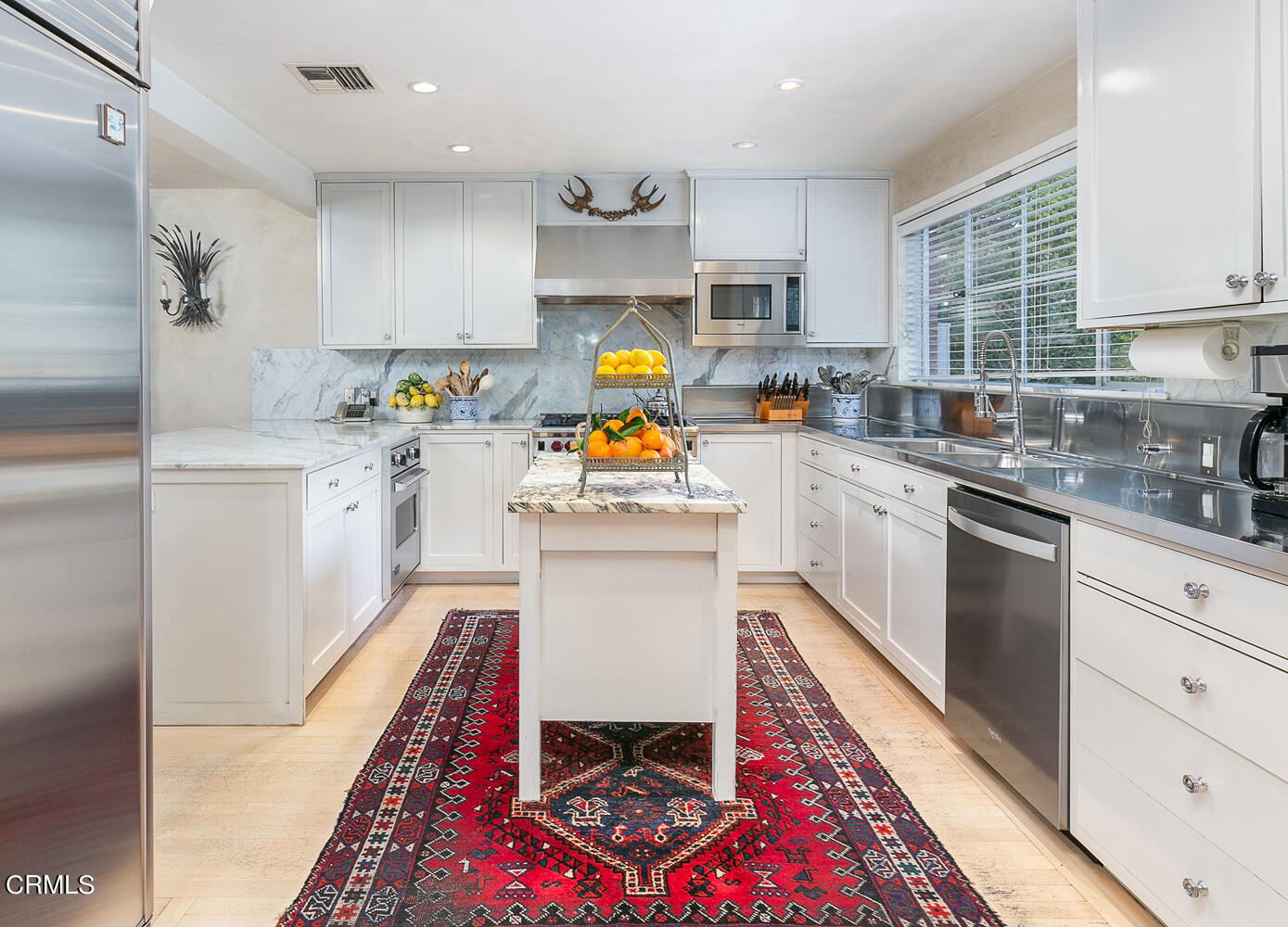 3 Oak Knoll Terrace Pasadena, CA 91106 - Photo 22 of 46 a kitchen with stainless steel appliances granite countertop a sink dishwasher a stove top oven a refrigerator and cabinets with wooden floor