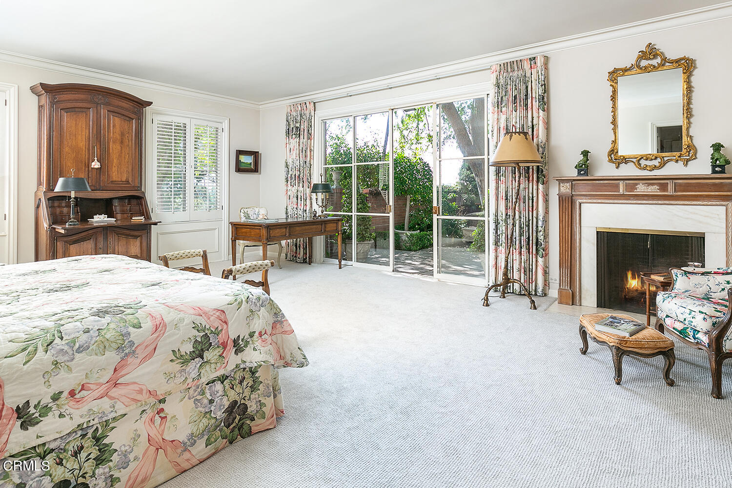 3 Oak Knoll Terrace Pasadena, CA 91106 - Photo 25 of 46 a spacious bedroom with a bed and a fireplace