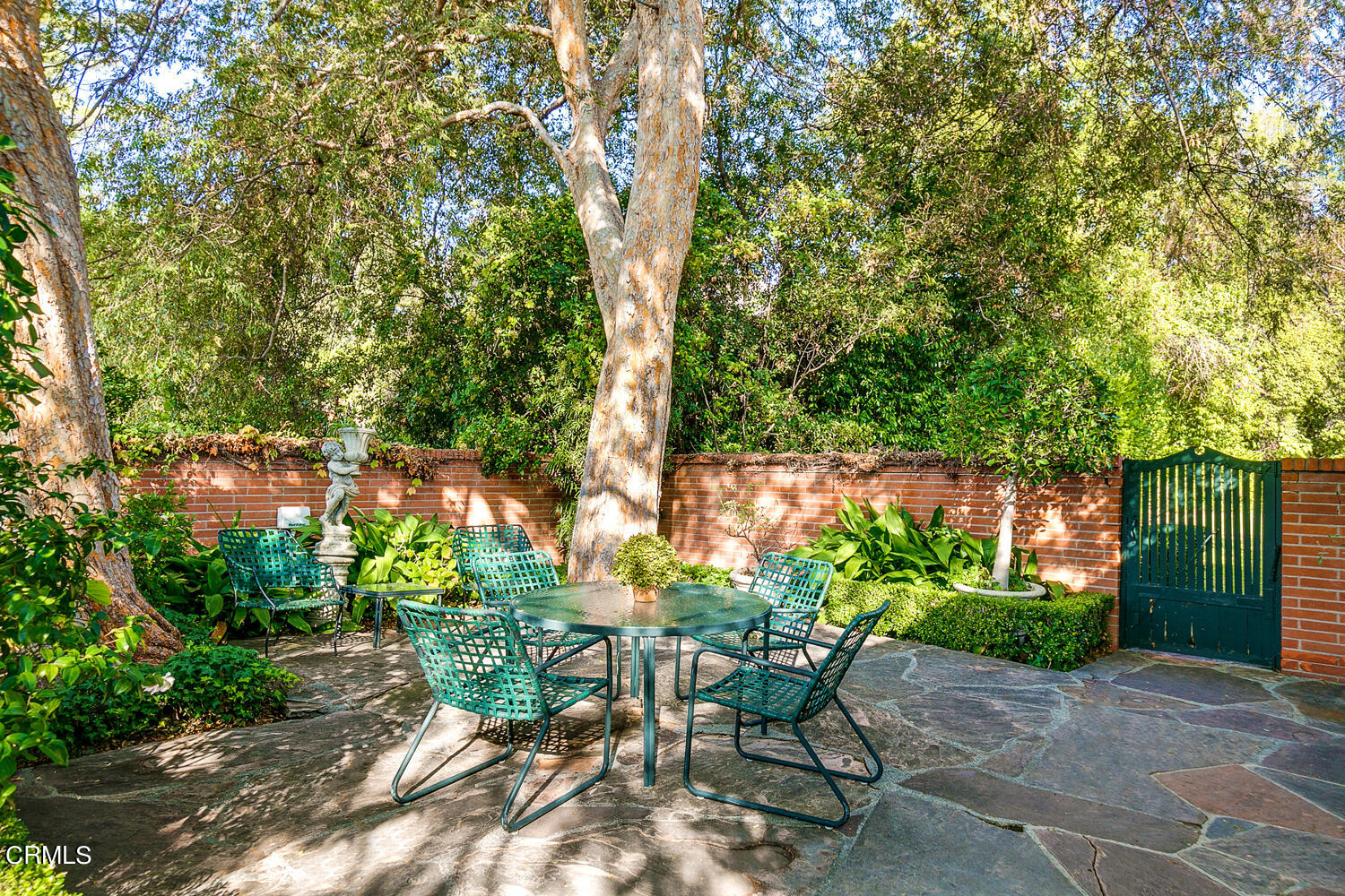 3 Oak Knoll Terrace Pasadena, CA 91106 - Photo 26 of 46 a backyard with chairs potted plants and large tree