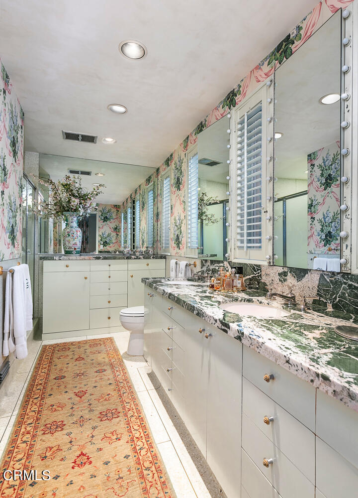 3 Oak Knoll Terrace Pasadena, CA 91106 - Photo 27 of 46 a bathroom with a tub sink and mirror