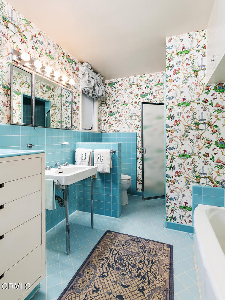 3 Oak Knoll Terrace Pasadena, CA 91106 - Photo 30 of 46 a bathroom with a sink and a mirror