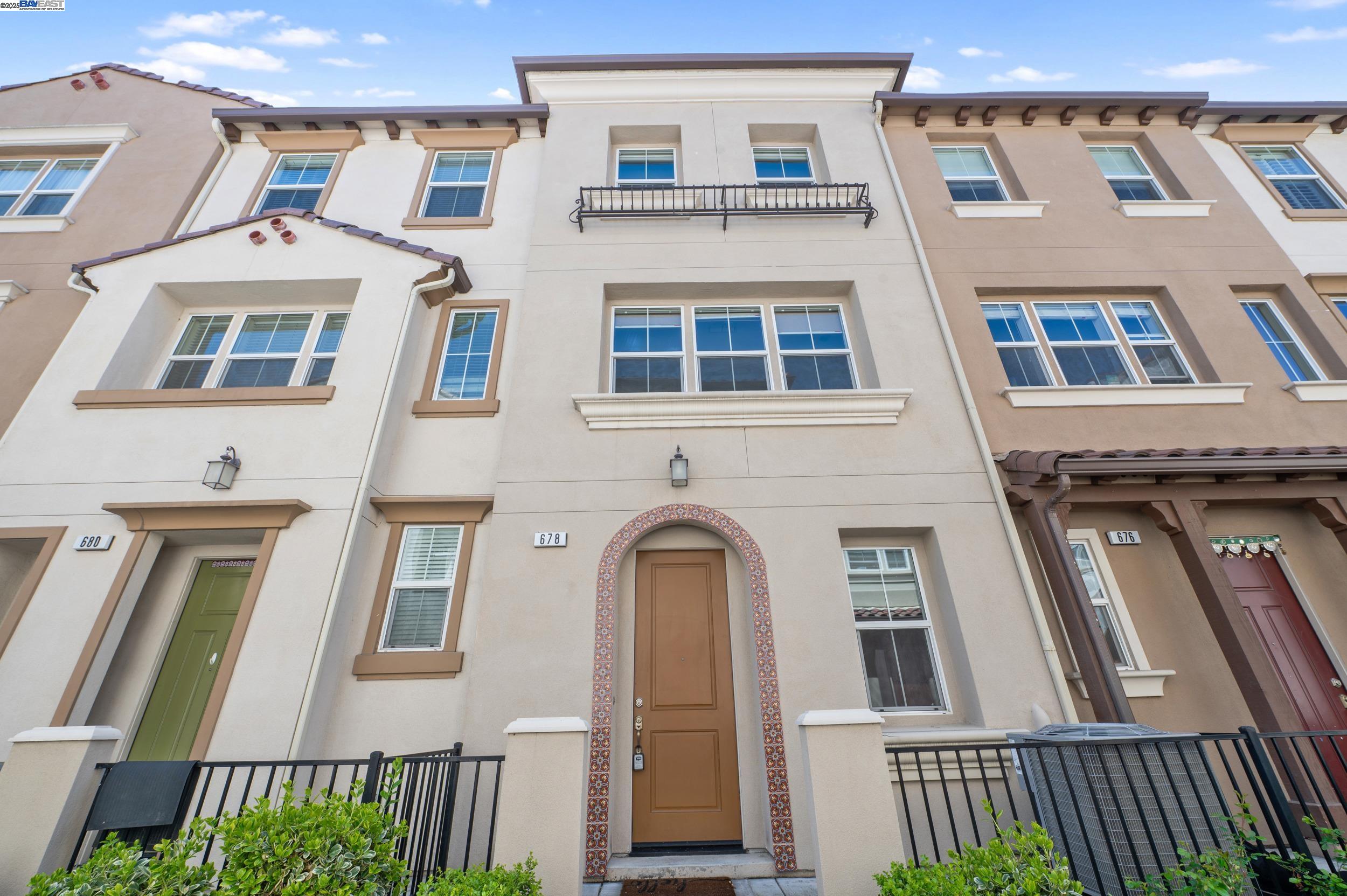 678 Barcelona Loop Milpitas, CA 95035 - Photo 1 of 1 a front view of a multi story residential apartment building