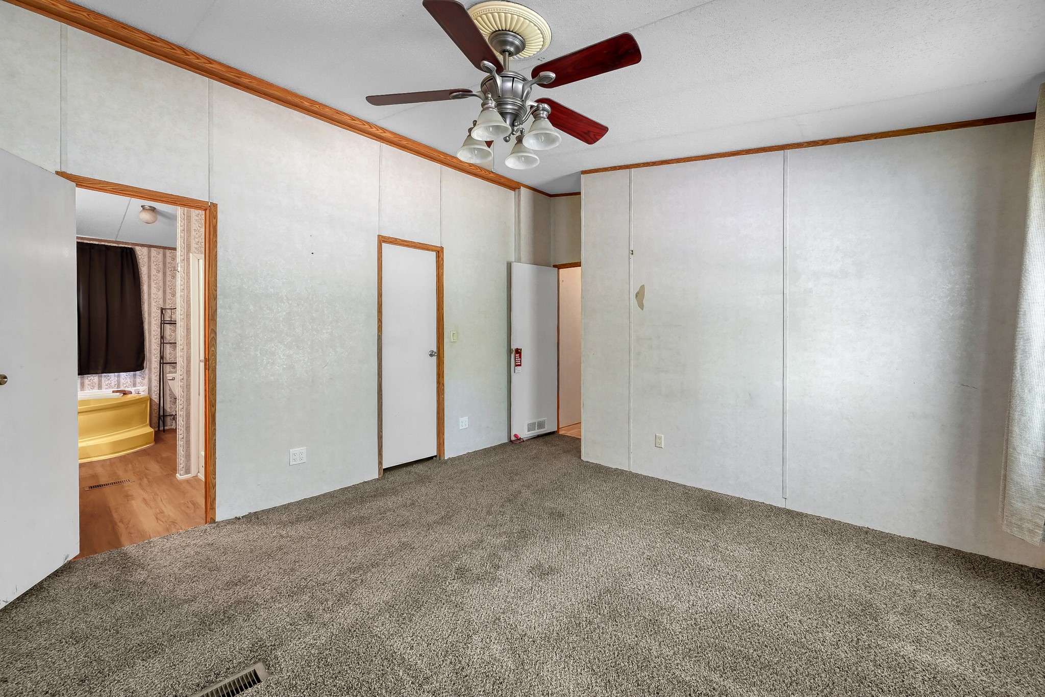 15350 Old Humble Pipeline Road Conroe, TX 77302 - Photo 12 of 38 a view of a livingroom with a ceiling fan and entryway