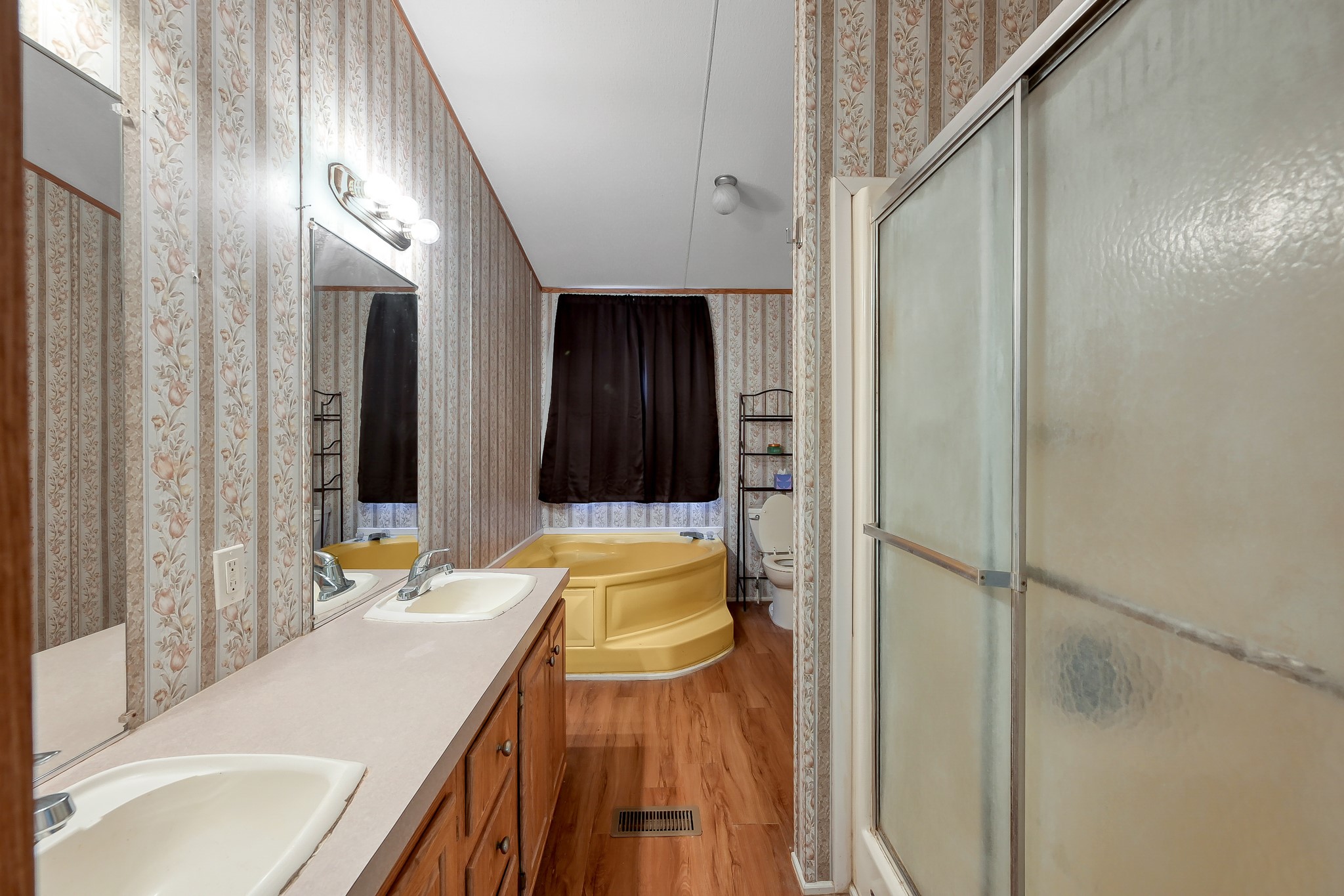 15350 Old Humble Pipeline Road Conroe, TX 77302 - Photo 13 of 38 a bathroom with a sink and a mirror